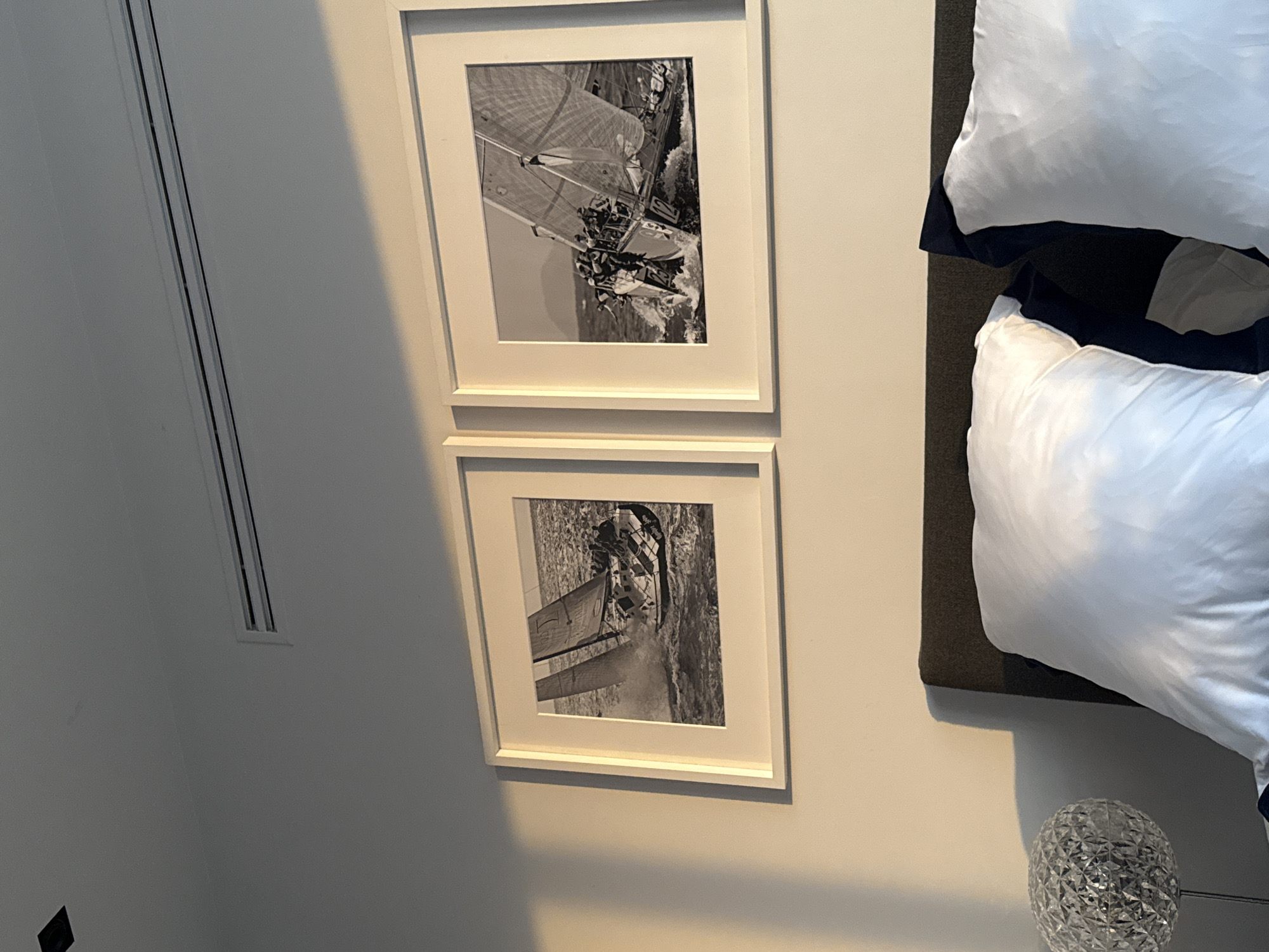 Mexico City bedroom displays sailboat artwork and lamp