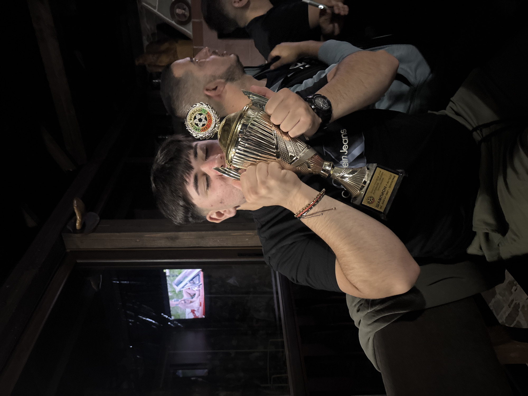 Young men celebrate soccer trophy victory in Zlatograd gathering
