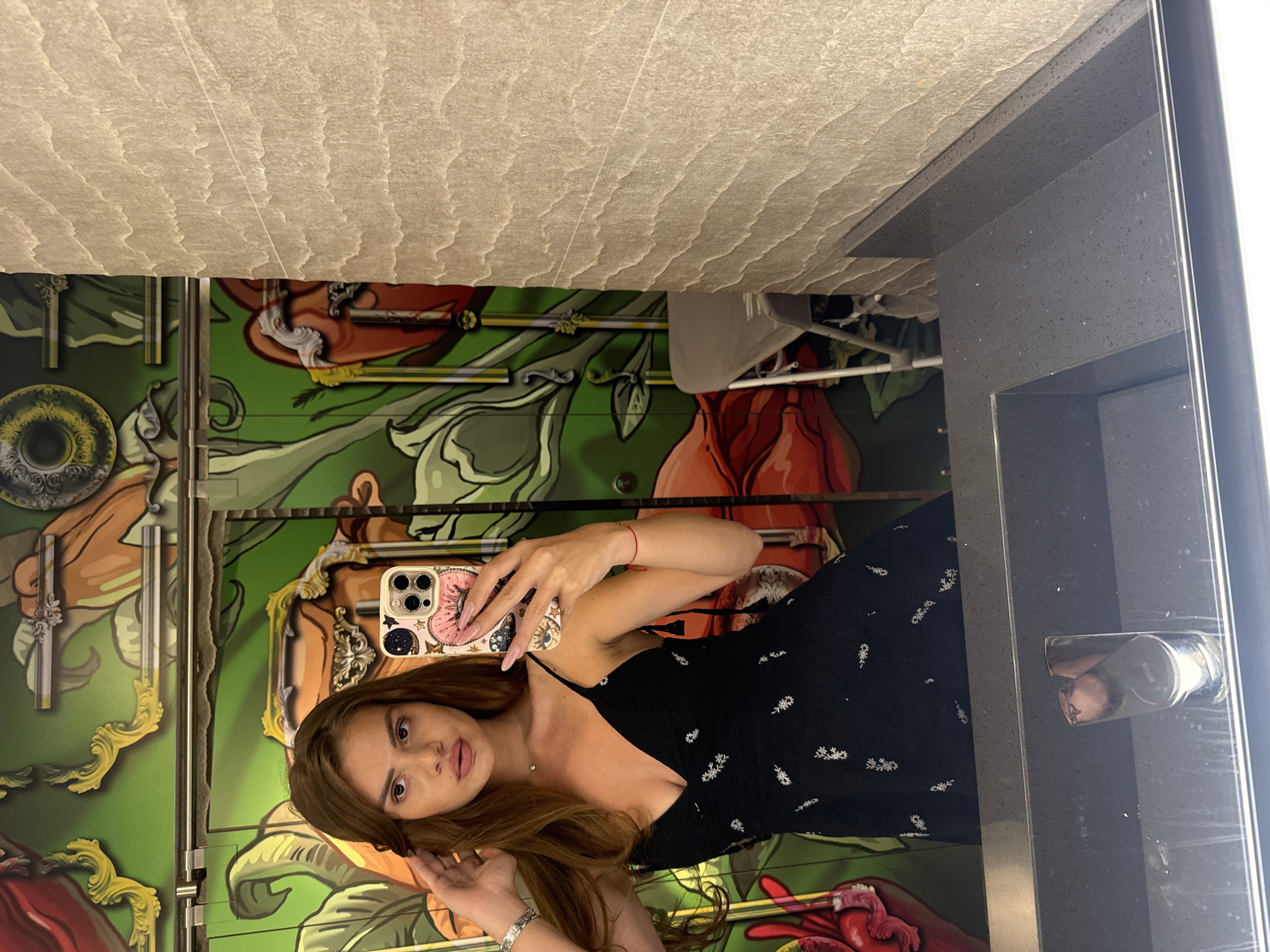 Woman documents dining experience with selfies and food photos in Plovdiv