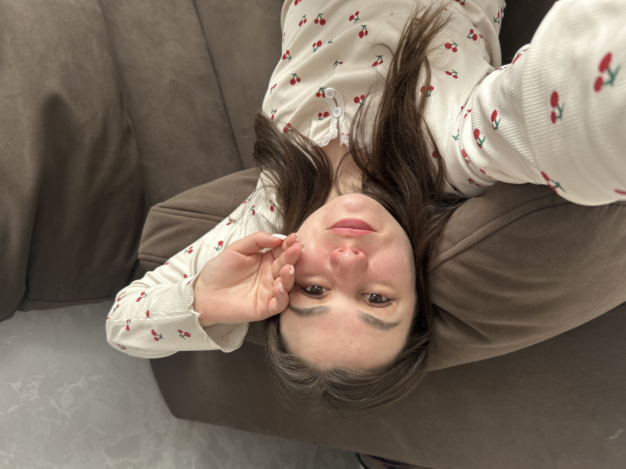 Morning family moment captured on sofa in Chaikovsky