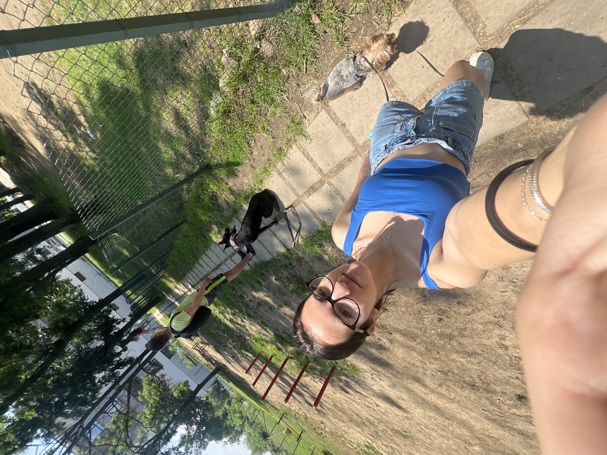Couple enjoys sunny morning dog walk in Sofia park