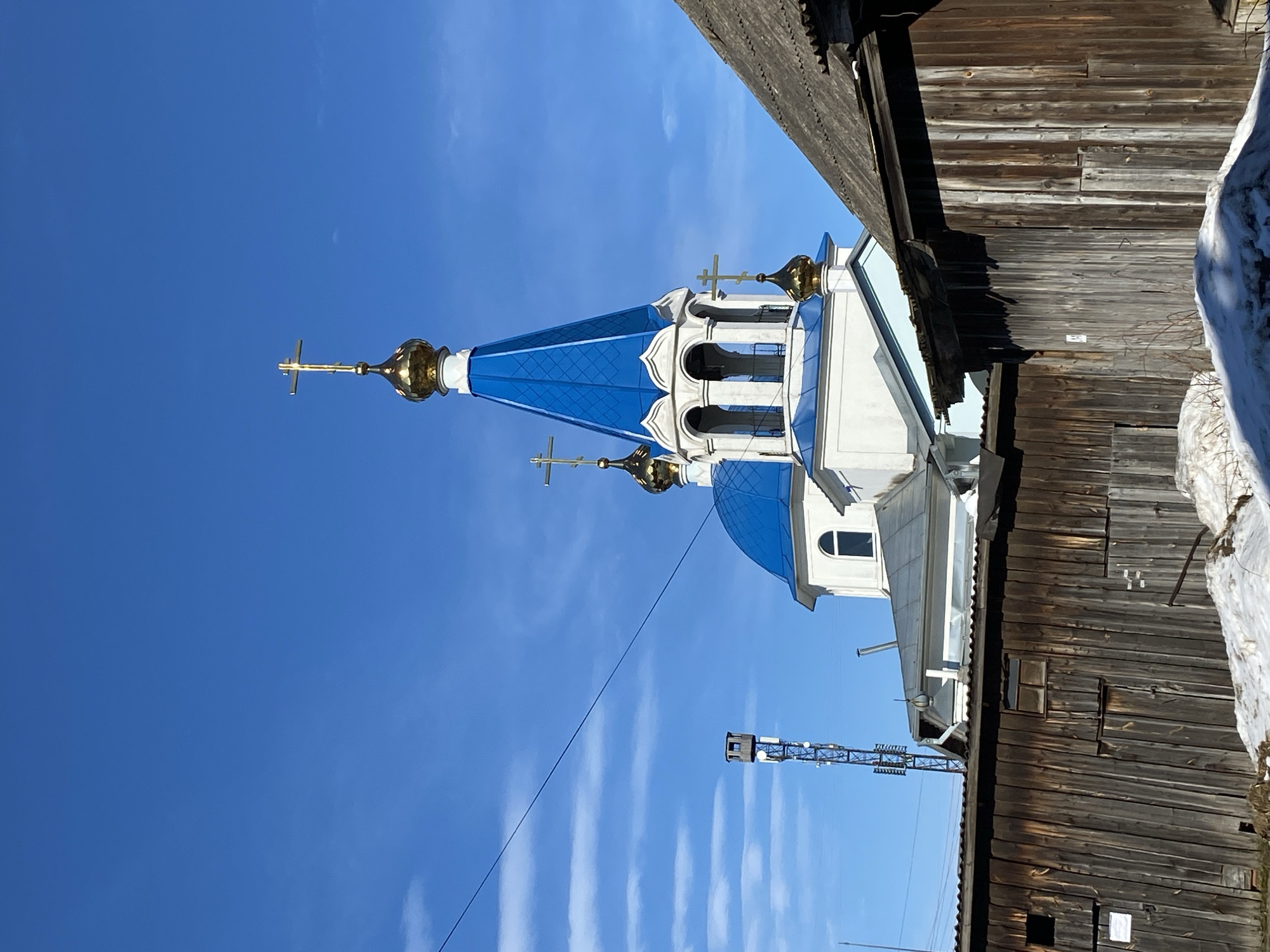 Child and woman photographed on motorcycle near Orthodox church