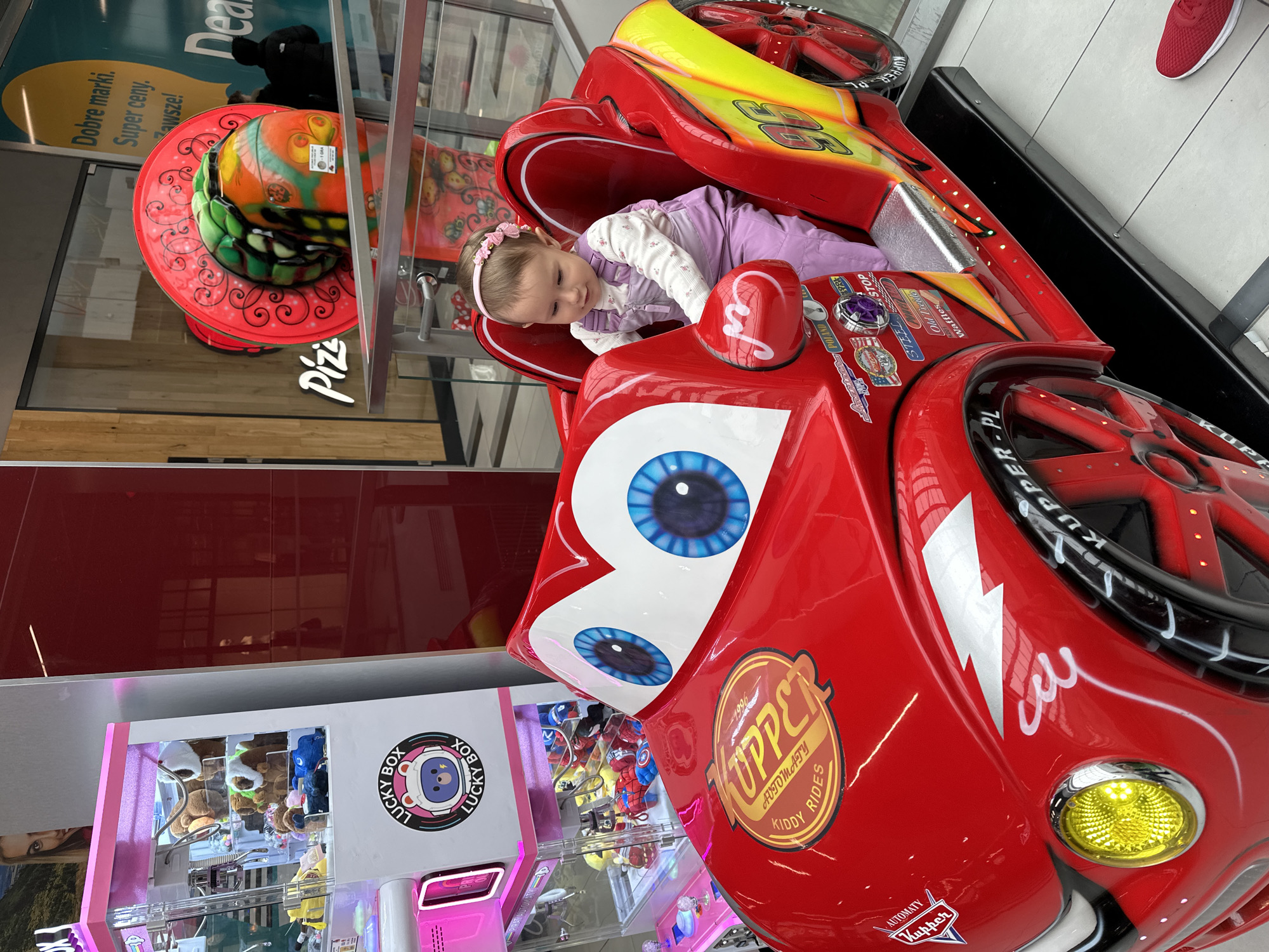 Child enjoys rides at Polish shopping mall