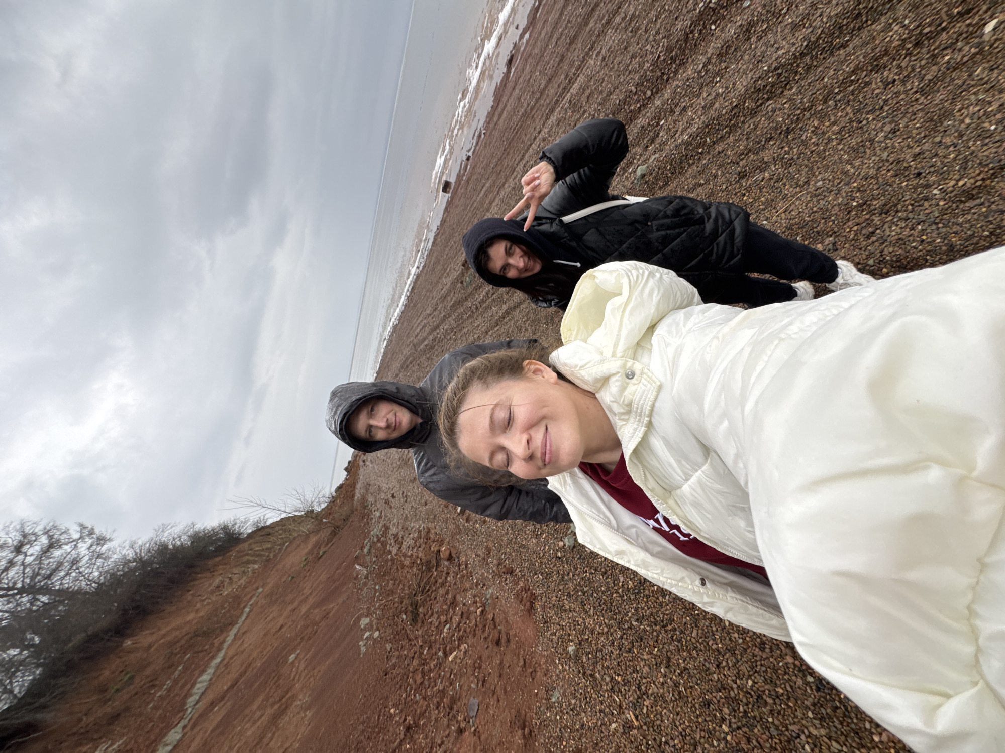 Three people photograph beach outing in Chaikovsky, Russia