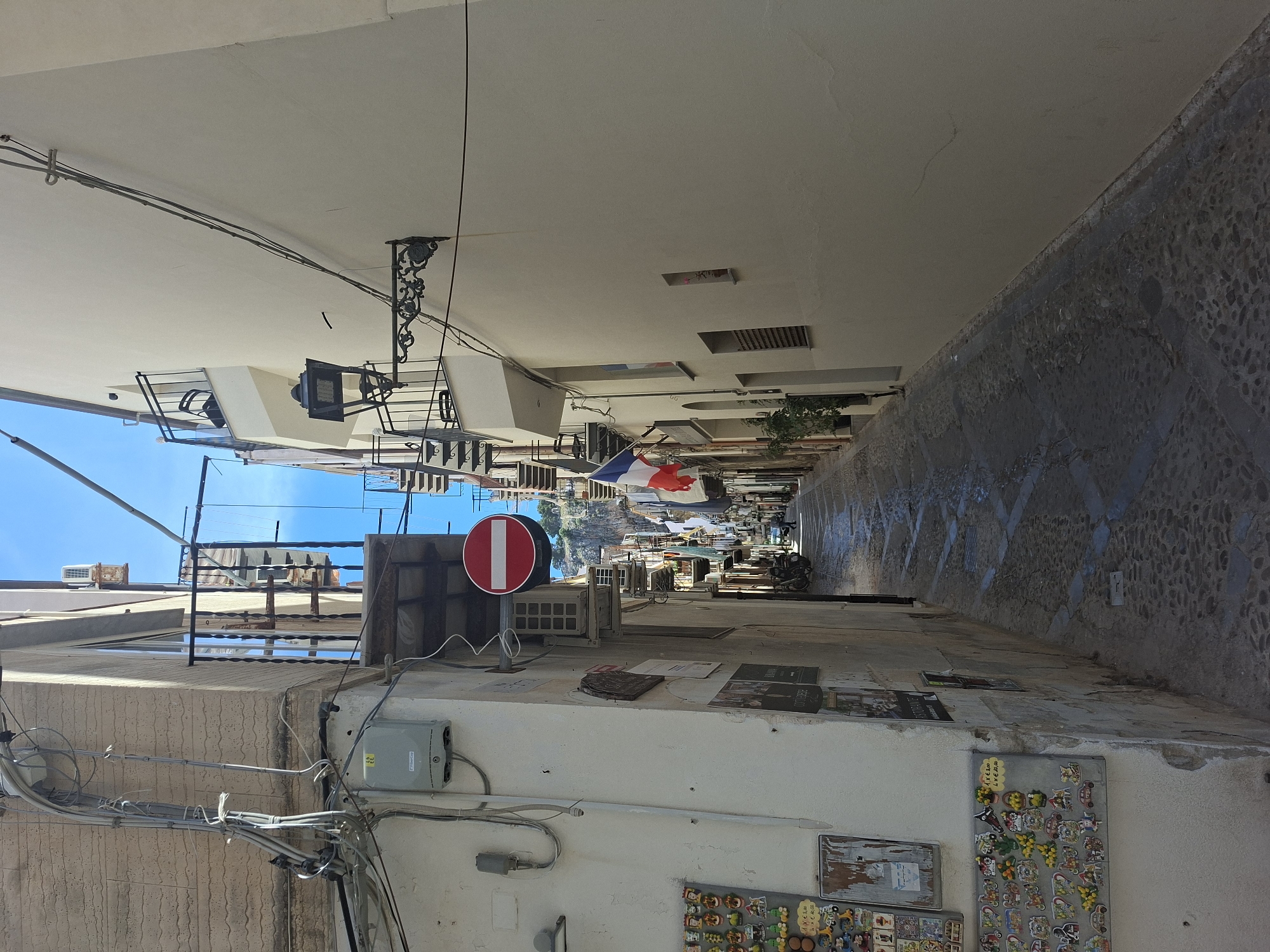 Narrow alleyway with white buildings documented in Cefalù, Italy