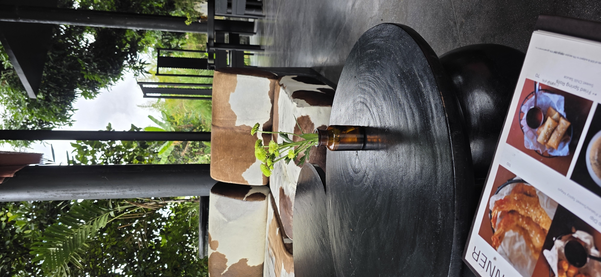 Relaxed resort evening in Kintamani — decor, greenery, and a sleeping cat