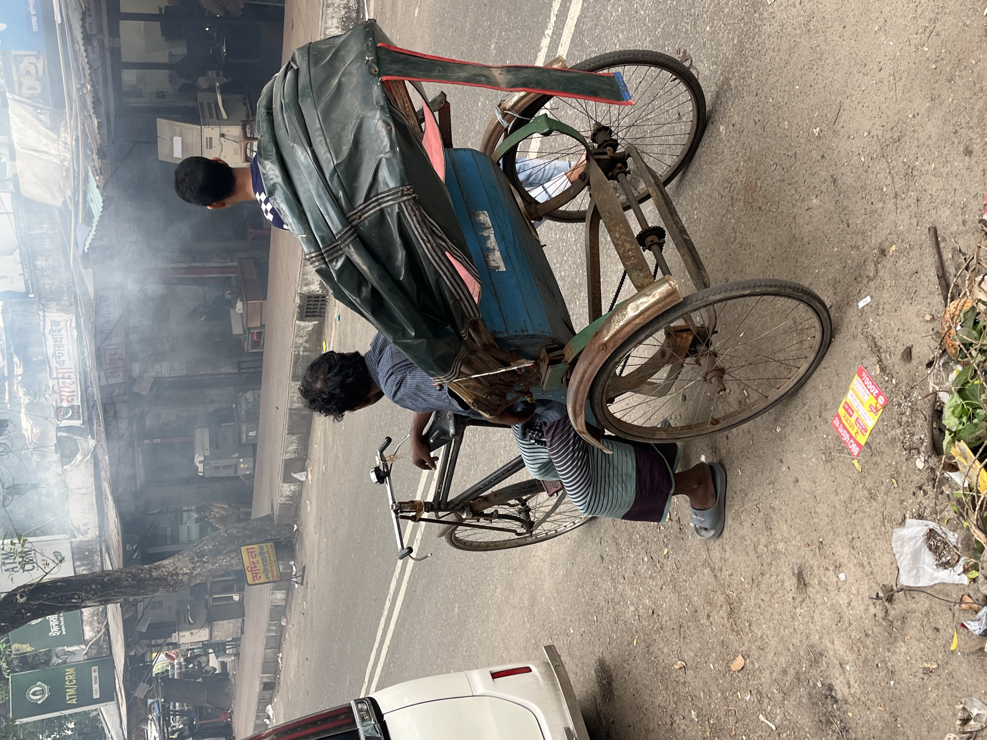 Rickshaw puller takes break in Dhaka