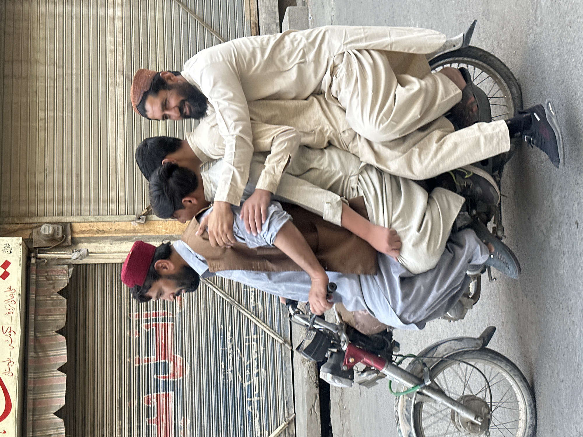 Four riders crammed onto one motorcycle in Quetta