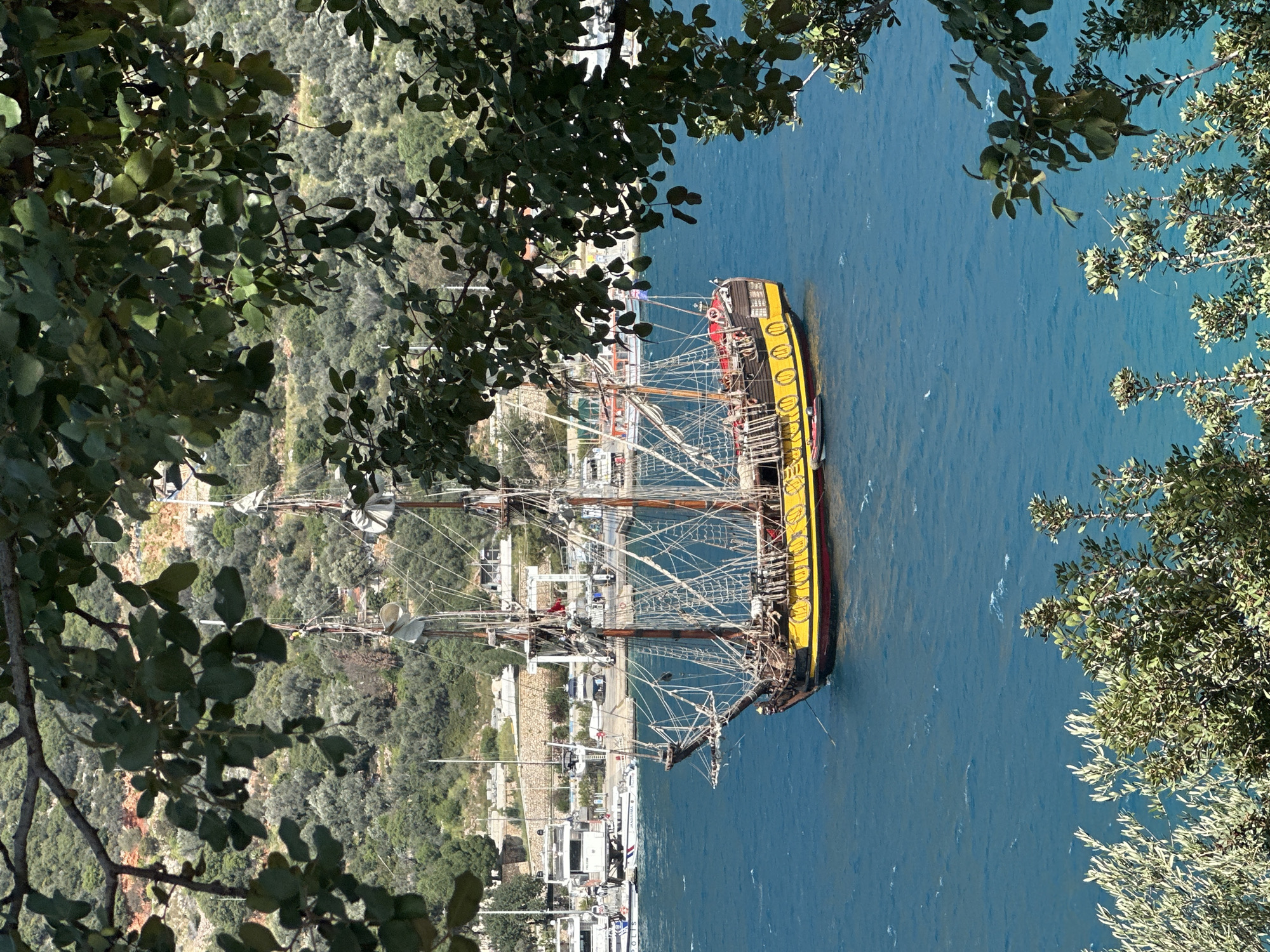 Traditional sailing ship docks at Turkish Mediterranean harbor