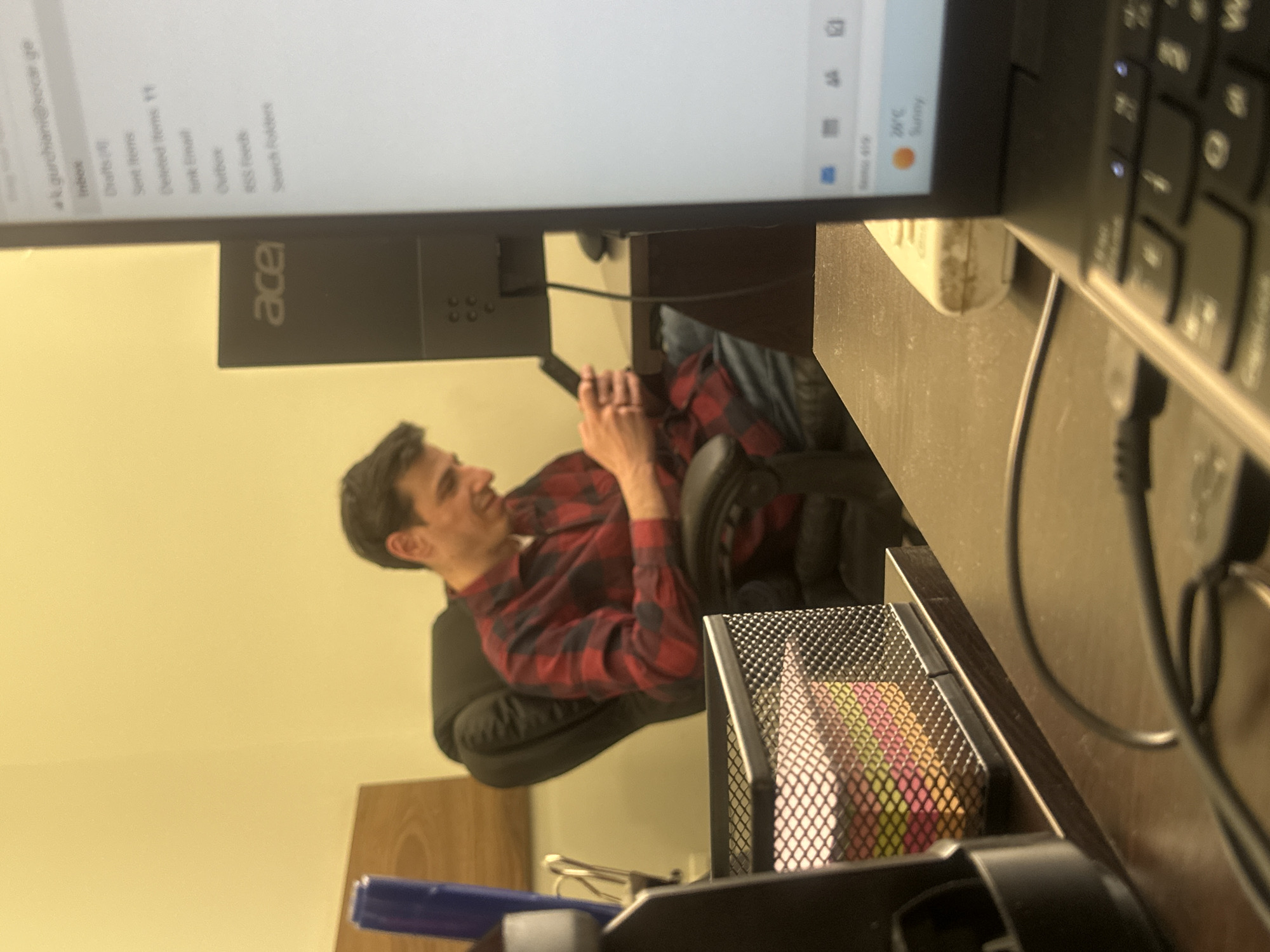 Office worker photographed during casual workplace session in Tbilisi
