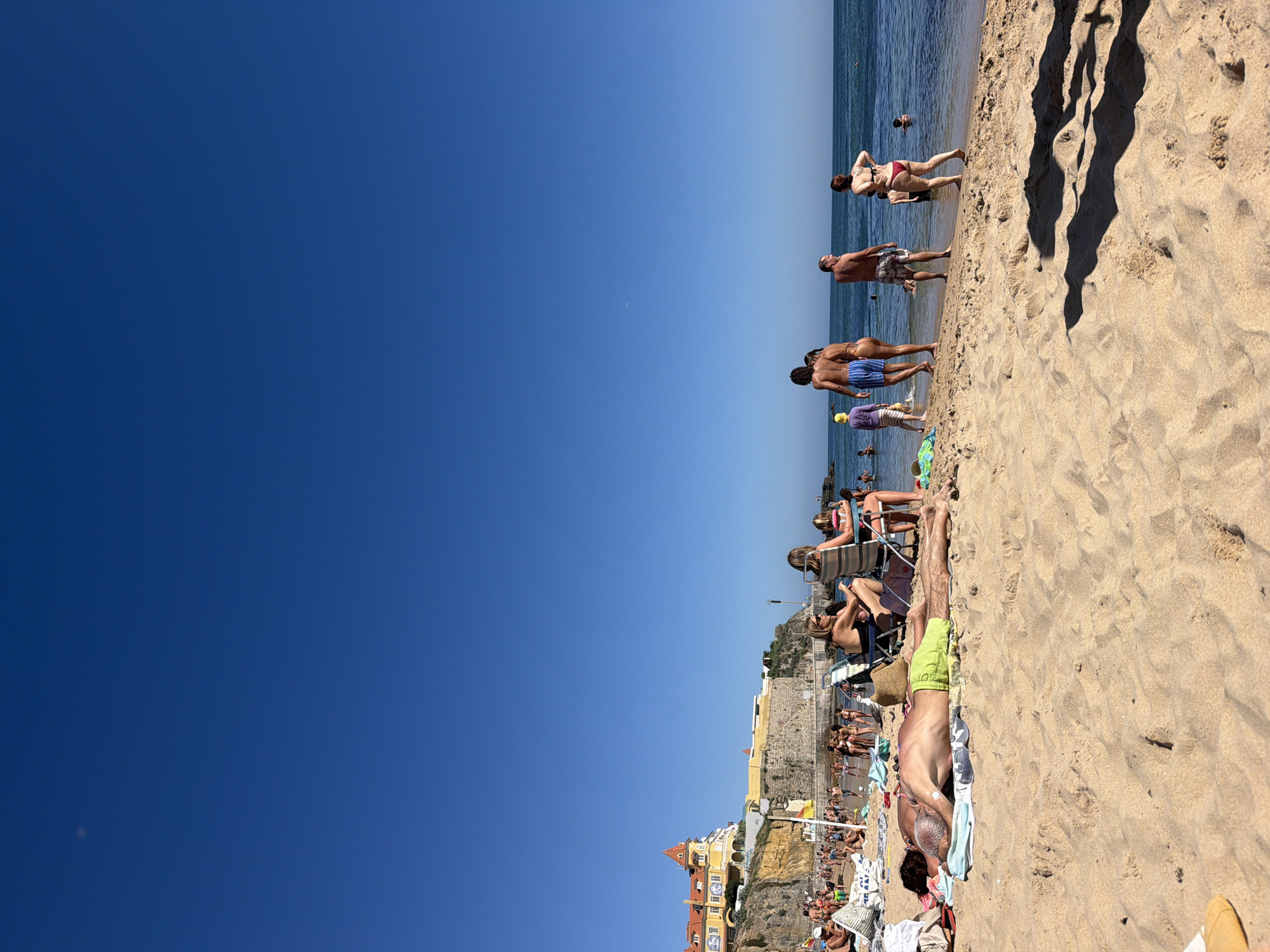 Crowded summer afternoon on the Cascais coastline