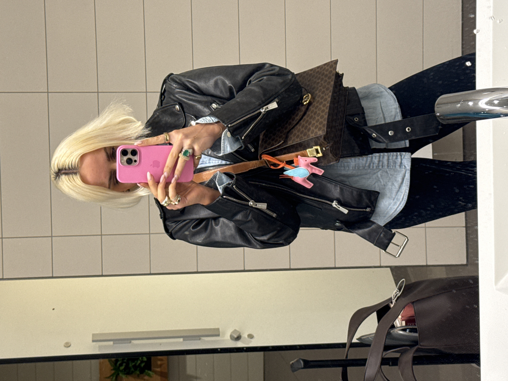 Woman photographs herself and accessories at Gardermoen airport