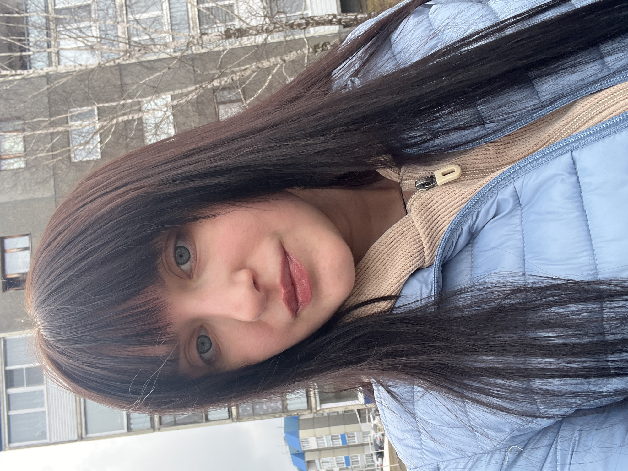 Woman takes selfies in different outfits in Марковский, Russia