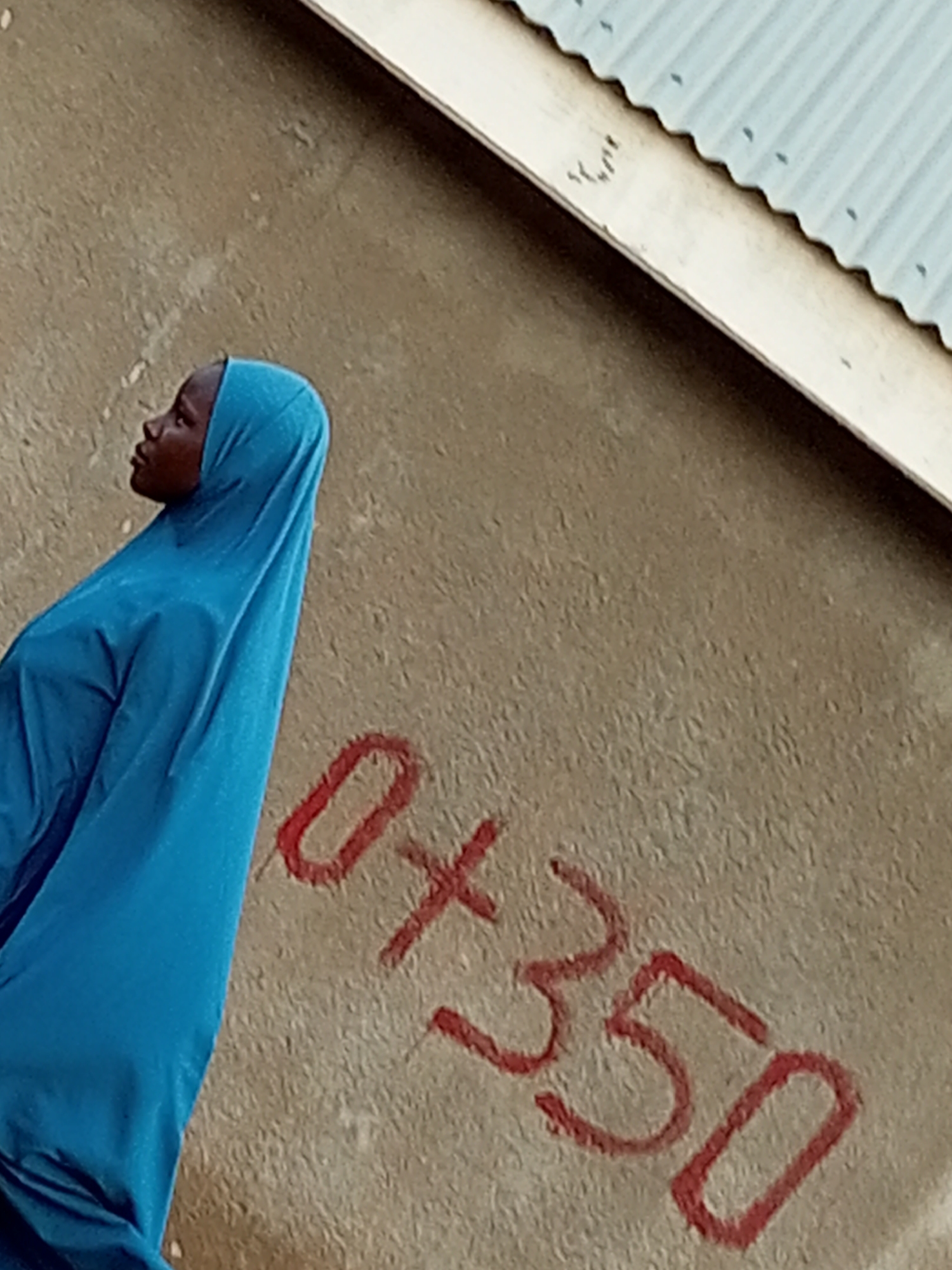 Morning street life near a dusty road in Gombe, Nigeria