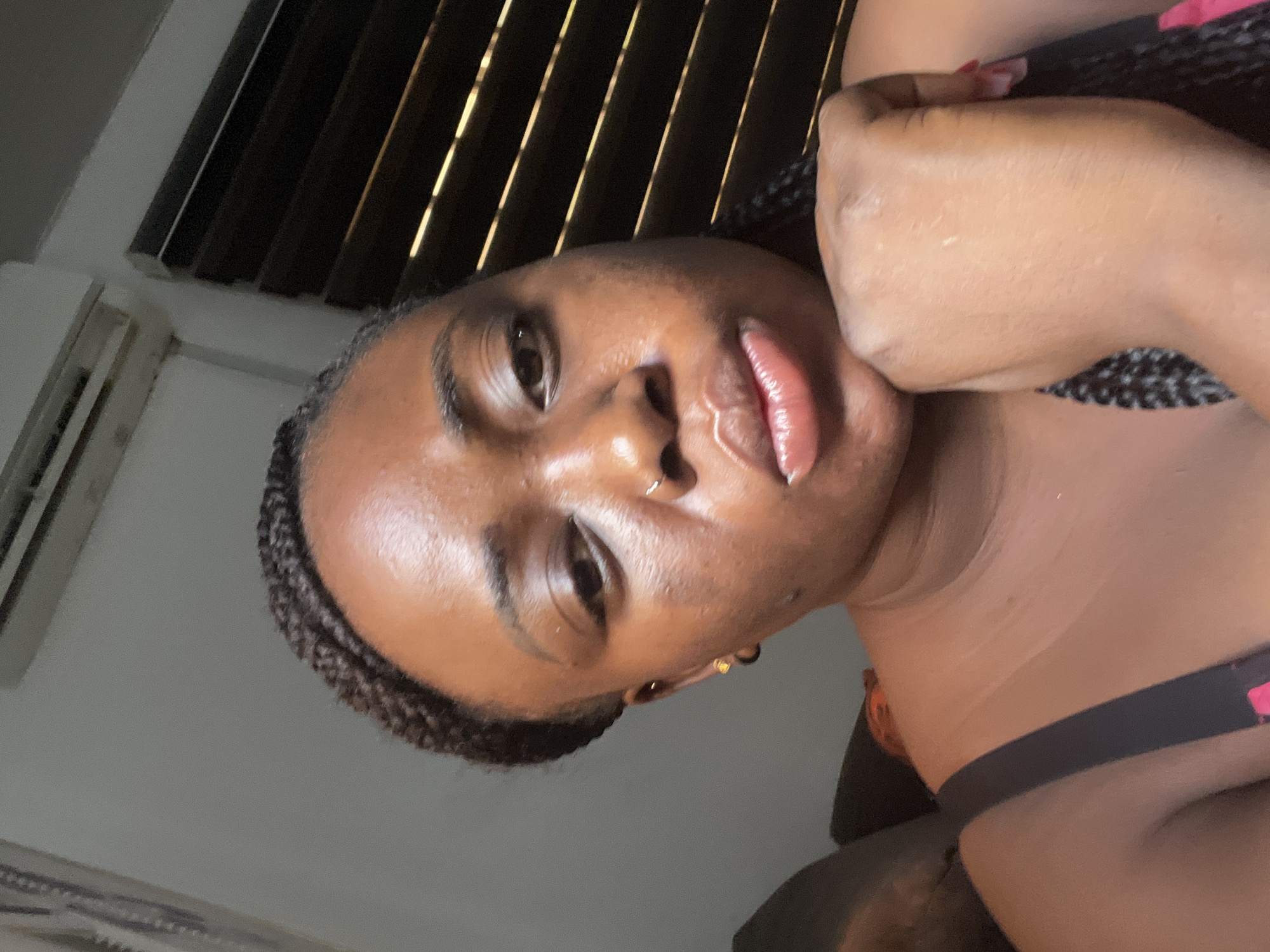 Woman takes morning selfies in Abuja bedroom