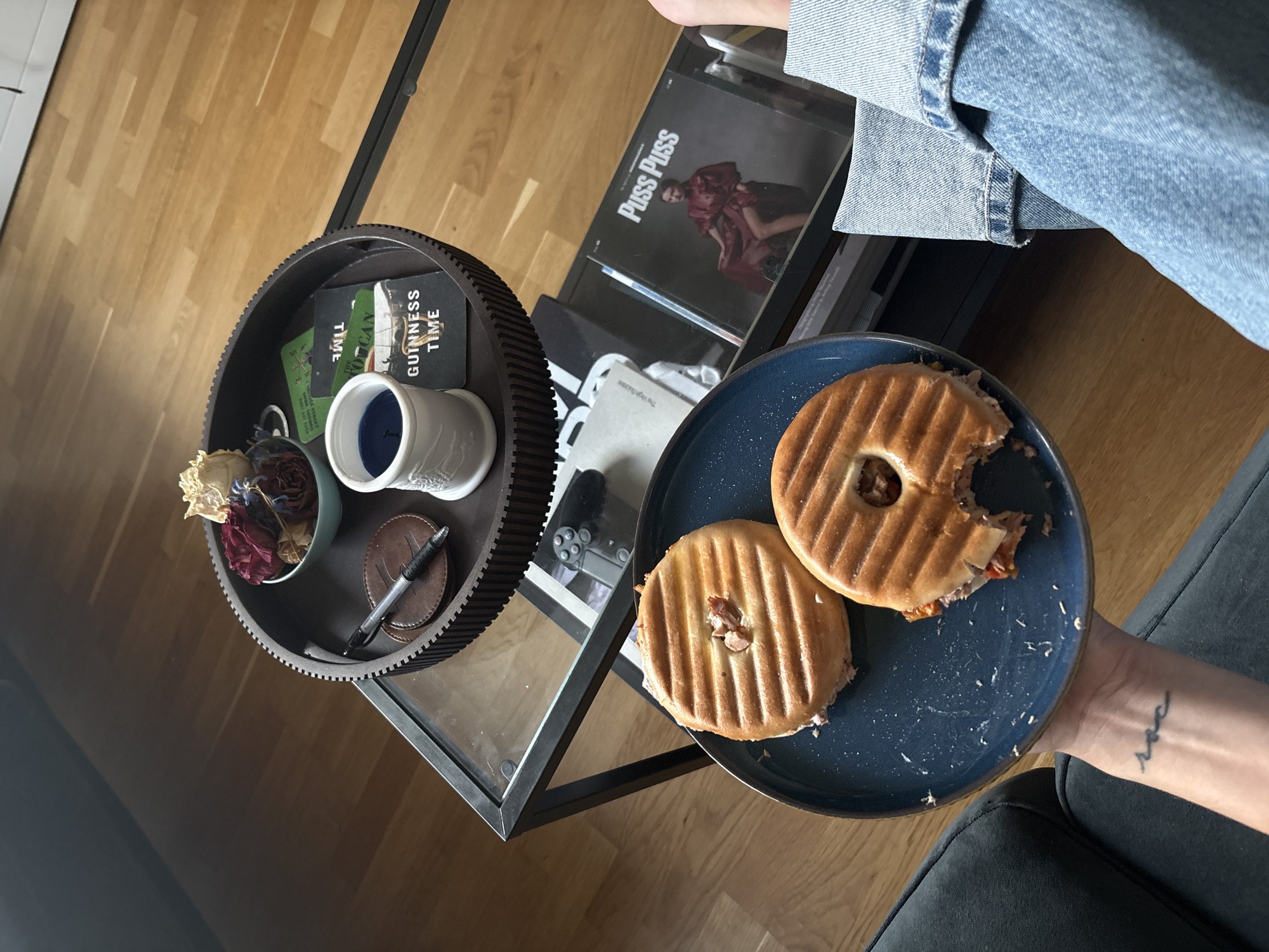 Paninis on a plate, sofa in the background, London evening
