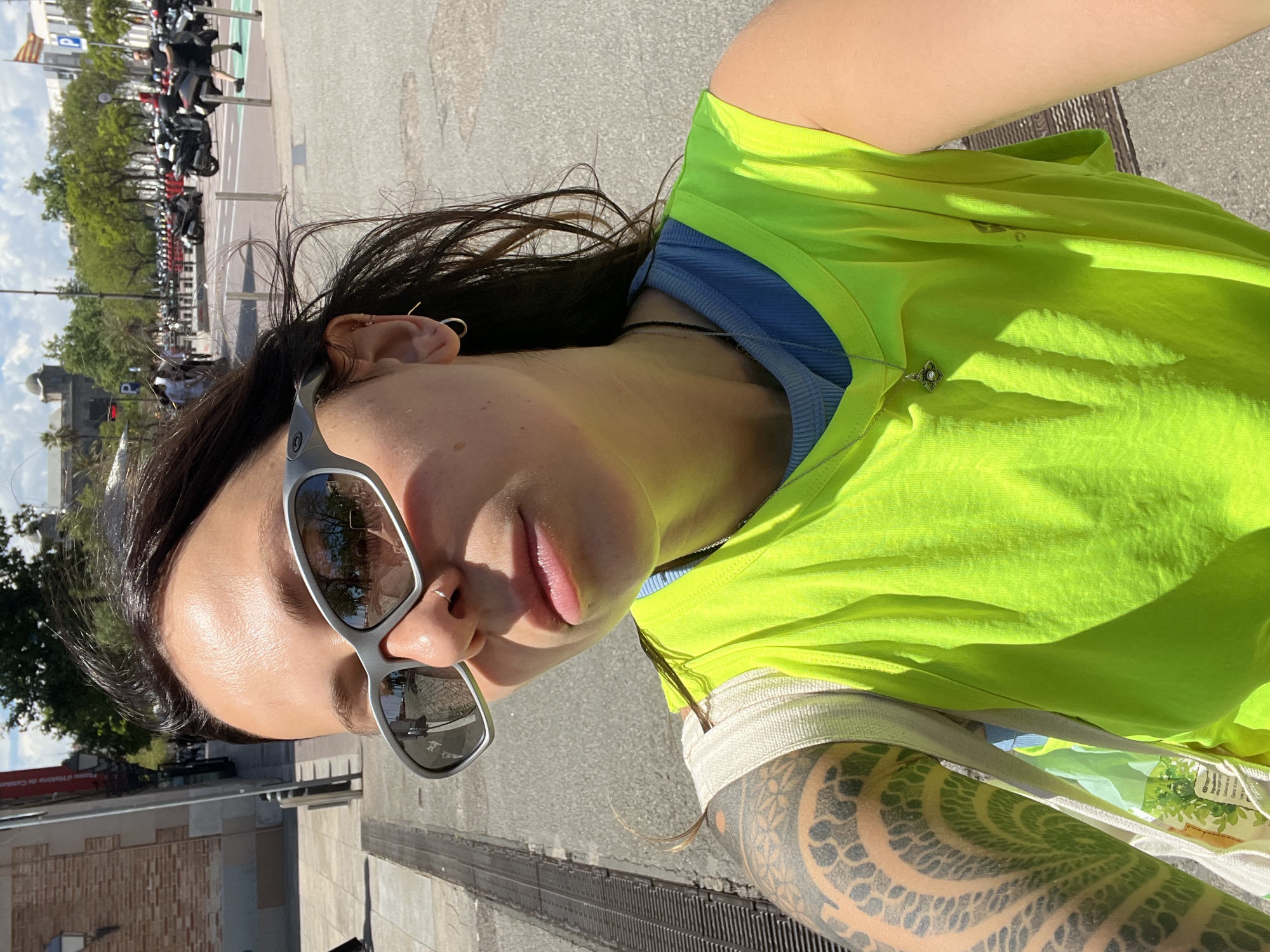 Woman takes multiple selfies around Barcelona during afternoon outing