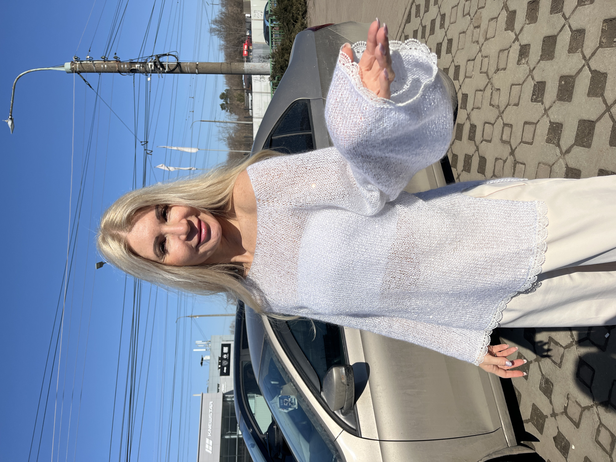 Woman poses for outdoor photo session with car in Nizhny Novgorod