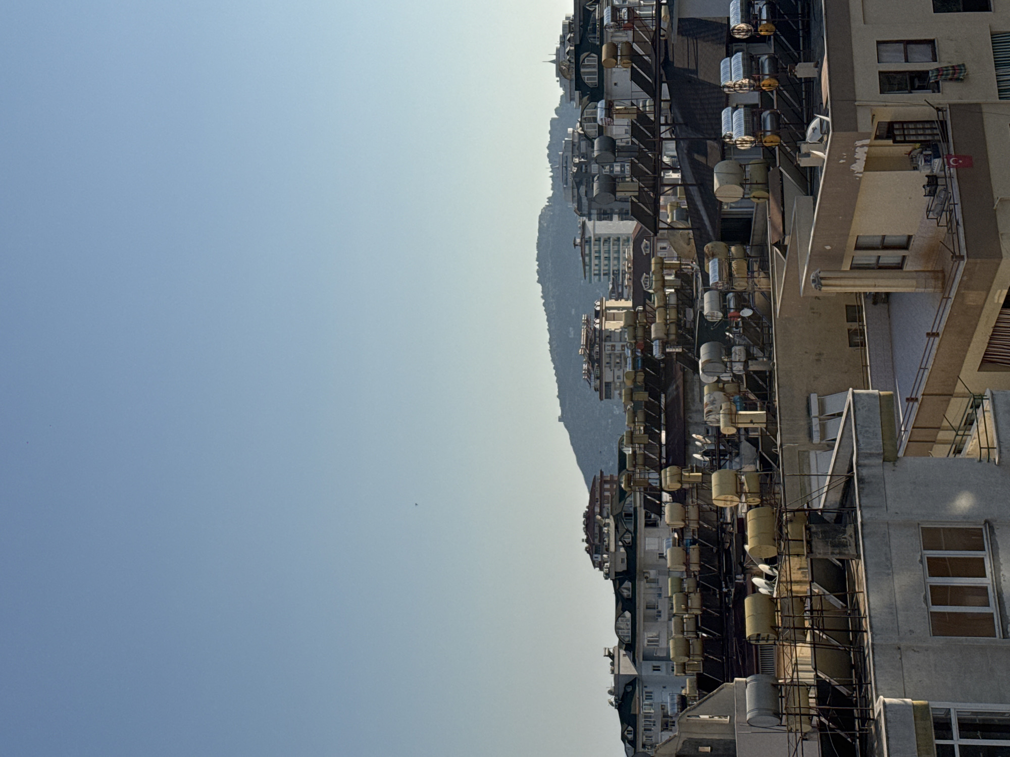 Alanya rooftops, coastal views, and a grey cat