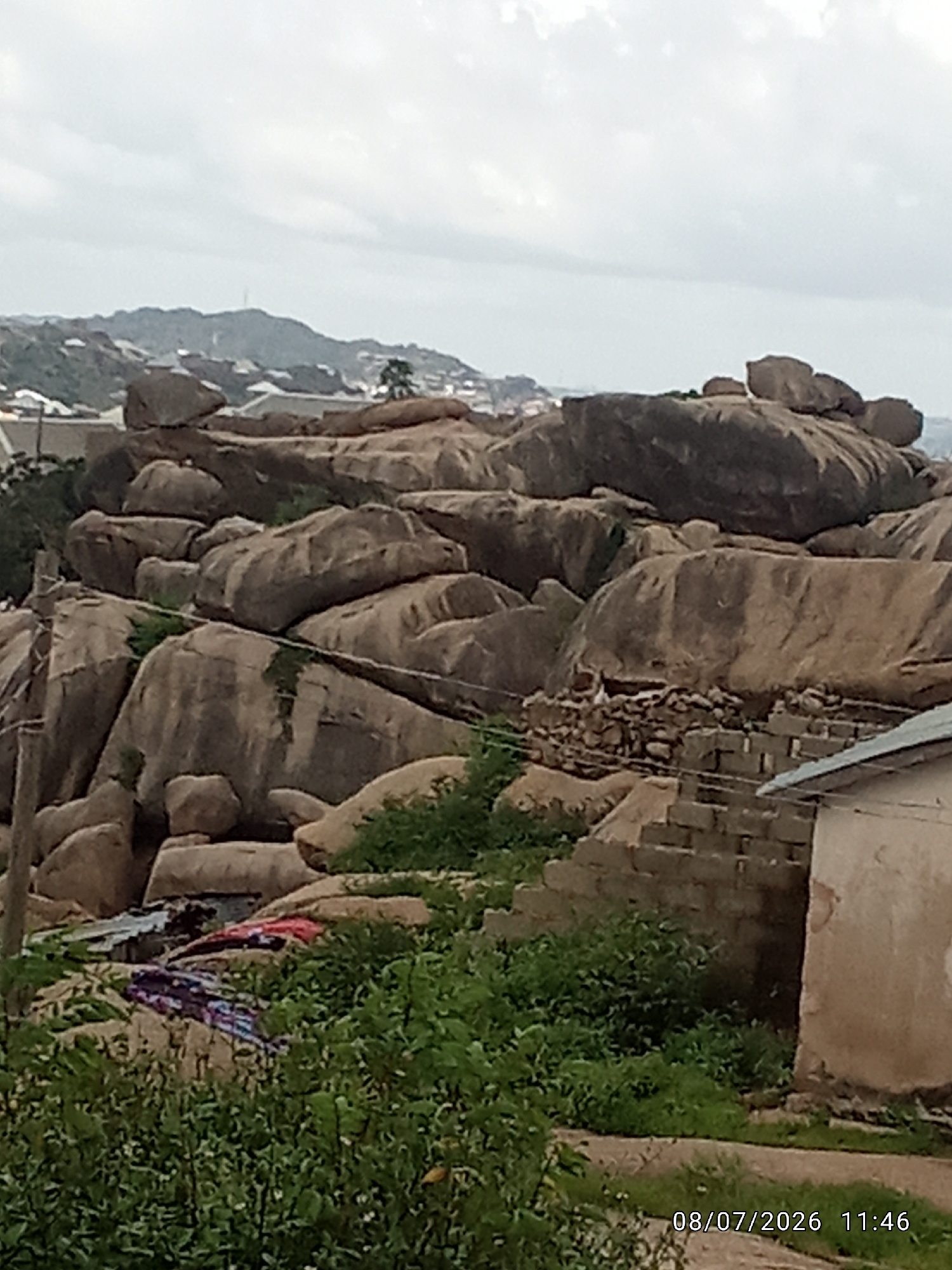 Daily life in a rocky informal settlement, pigs, markets, and kids
