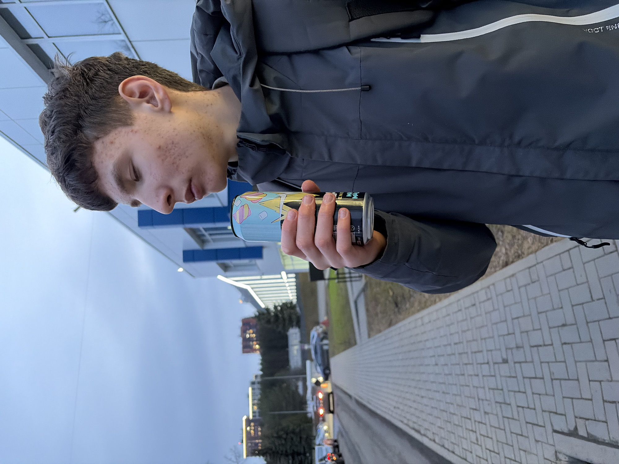 Young couple explores Izhevsk, snacking on pastries and cheese puffs