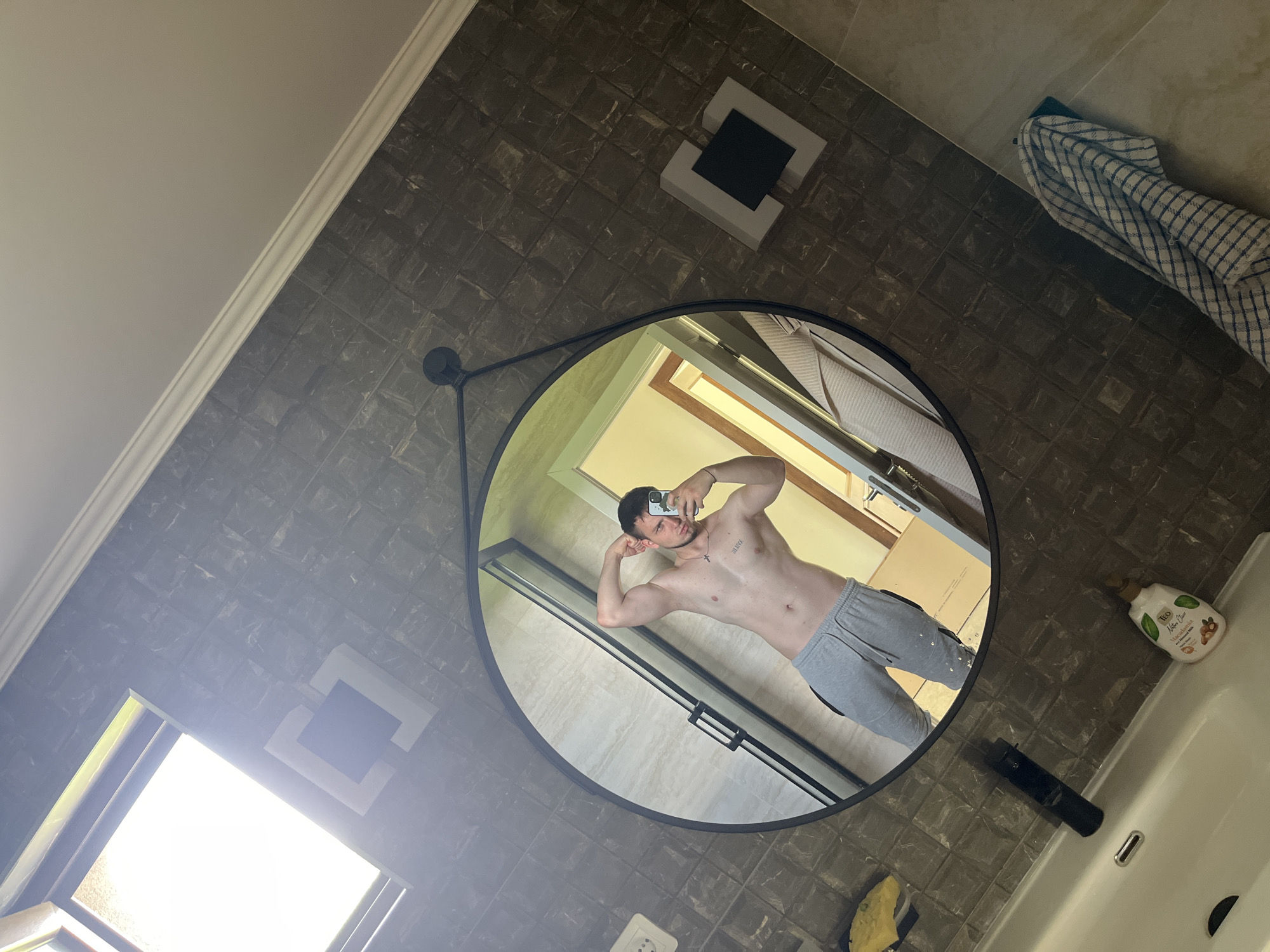 Man takes mirror selfies in bathroom in Войводино, Bulgaria