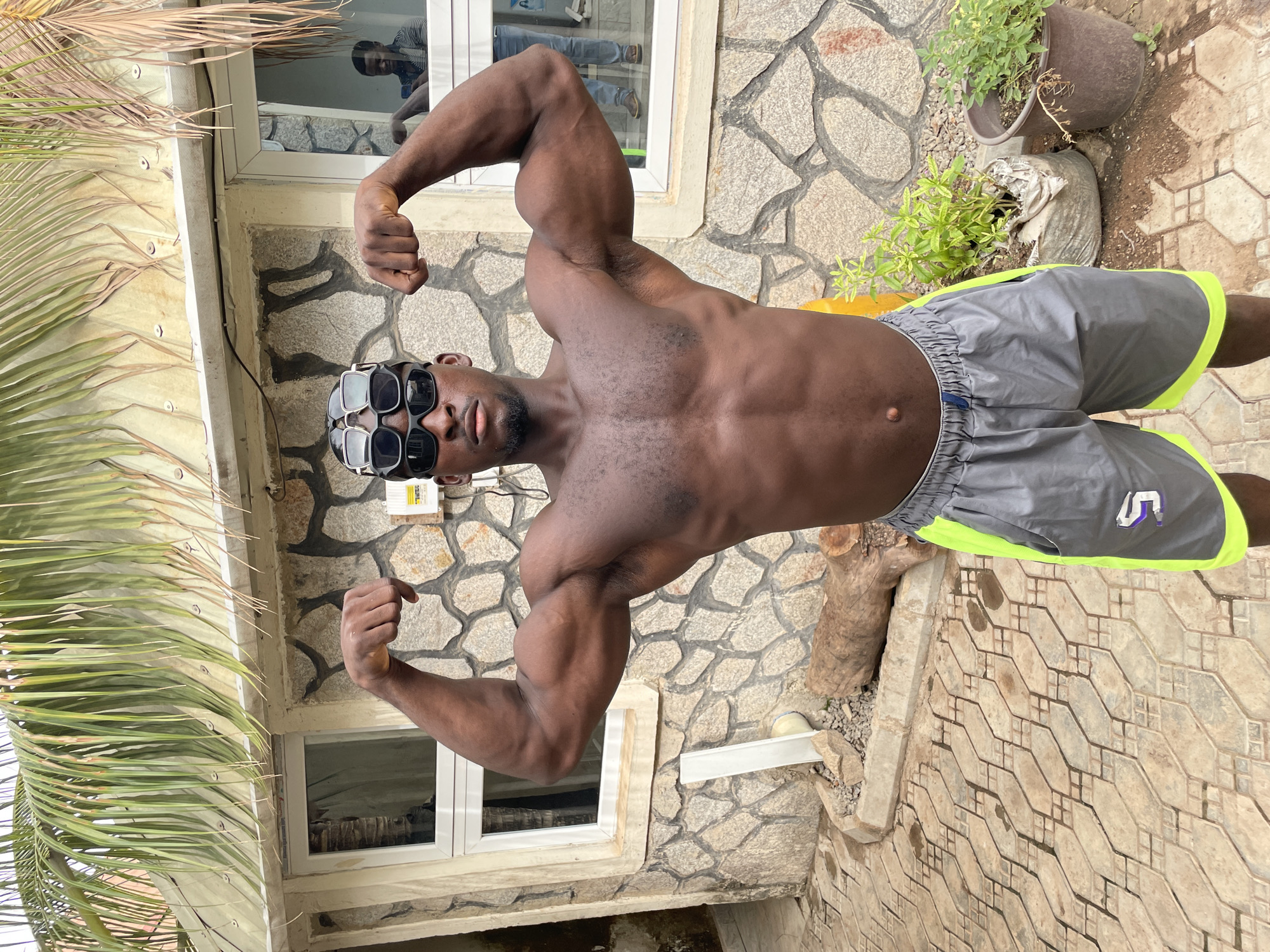Man exercises outdoors in Akwanga courtyard
