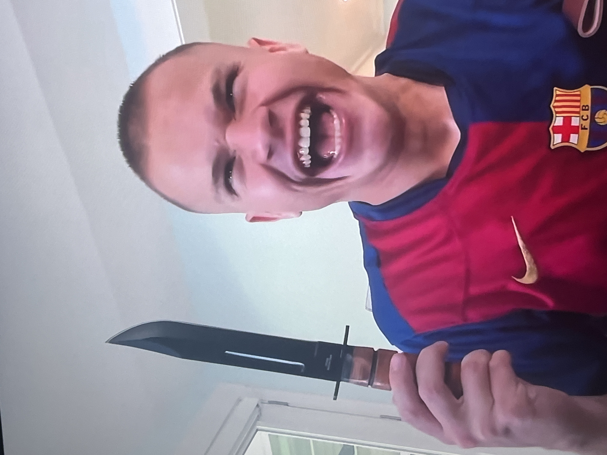 Barcelona fan makes exaggerated expression in Bragança, Portugal