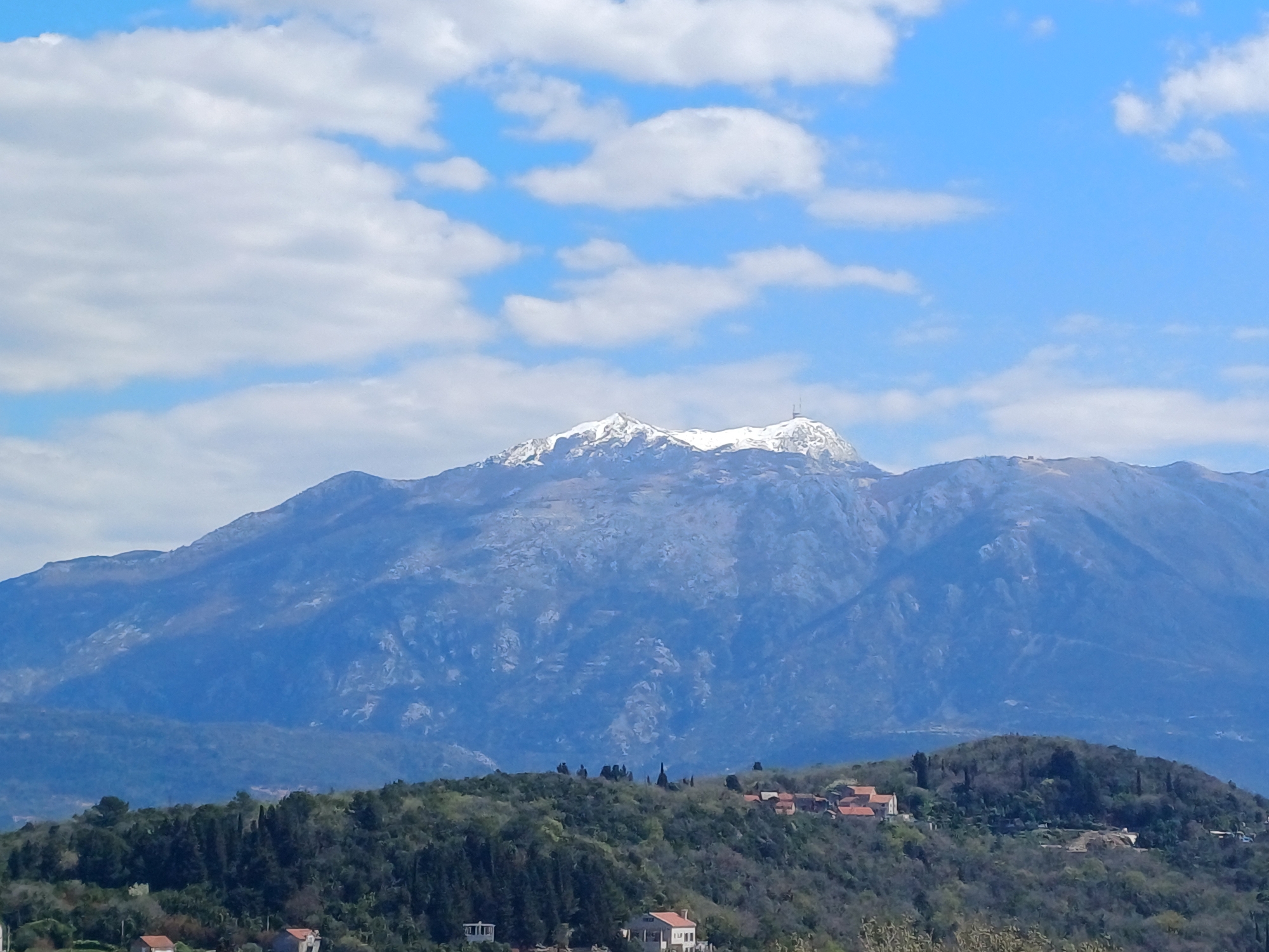 Snow-capped mountain with antenna observed in Montenegro