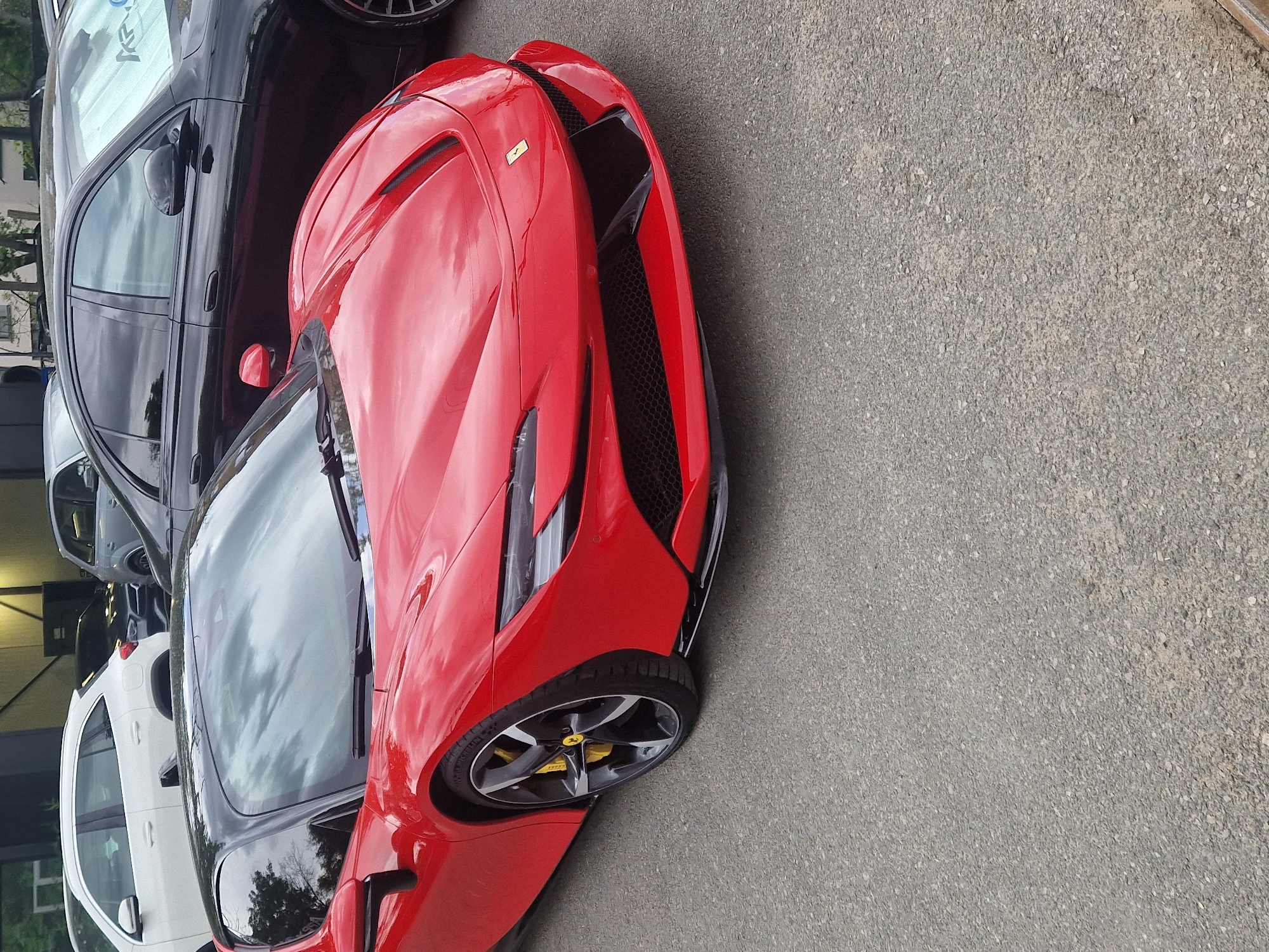 Ferrari spotted parked near pedestrian with bag