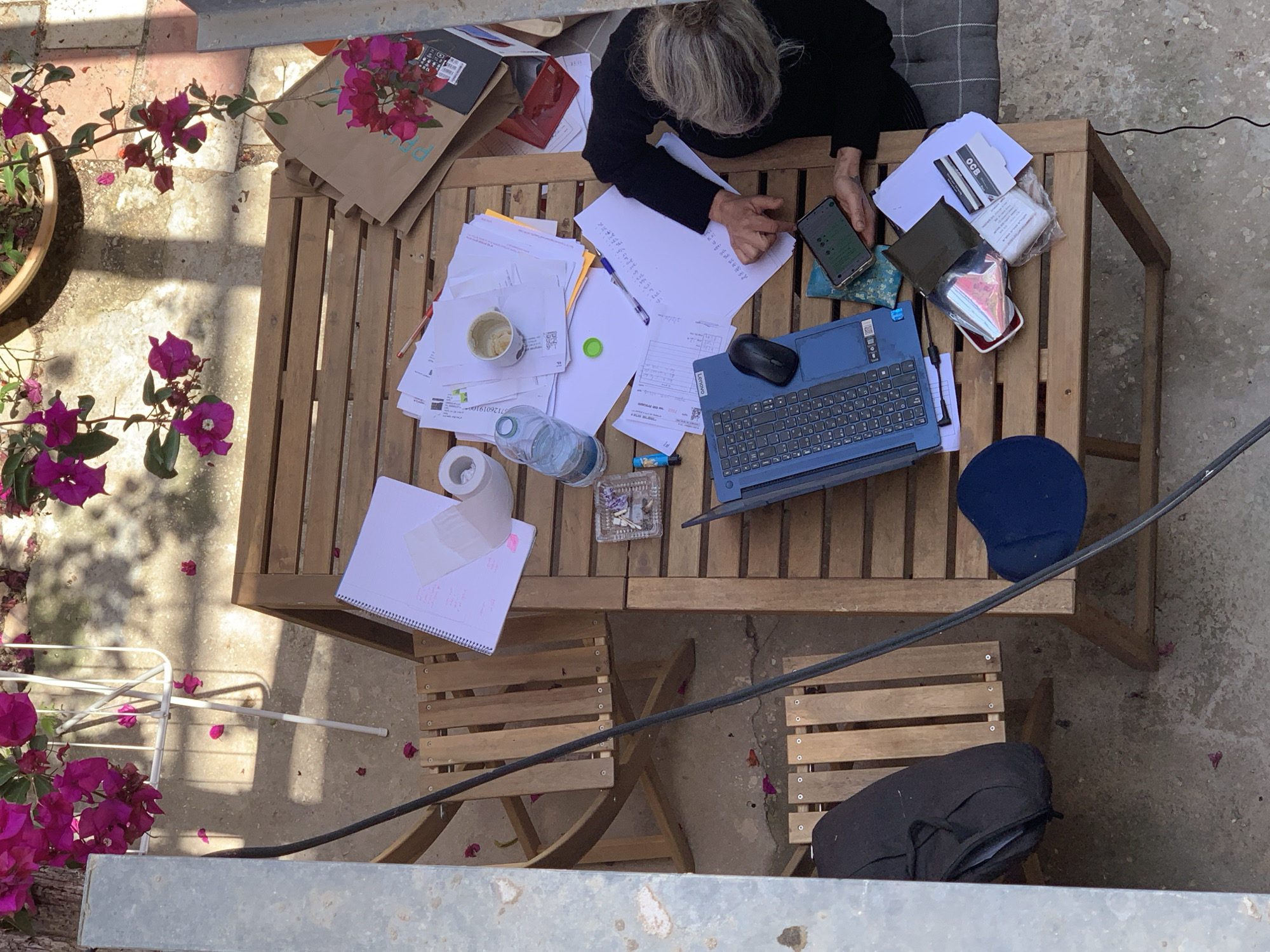 Person works outdoors at table in Tel Aviv