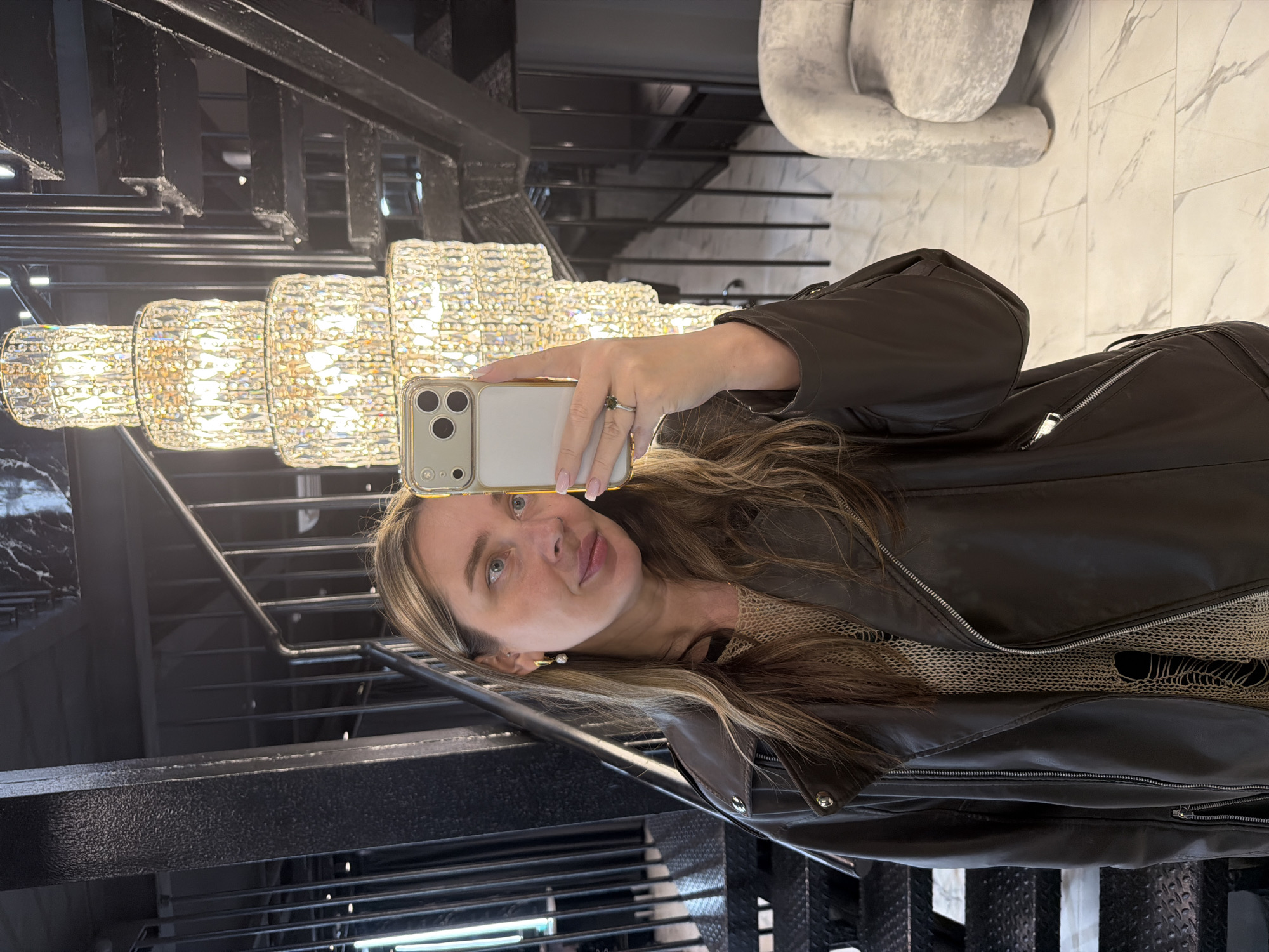 Woman takes selfies in upscale Moscow interior space