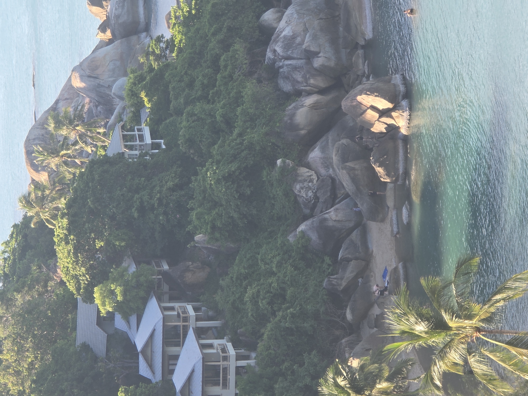 Hillside resort and ocean views on a tropical summer morning