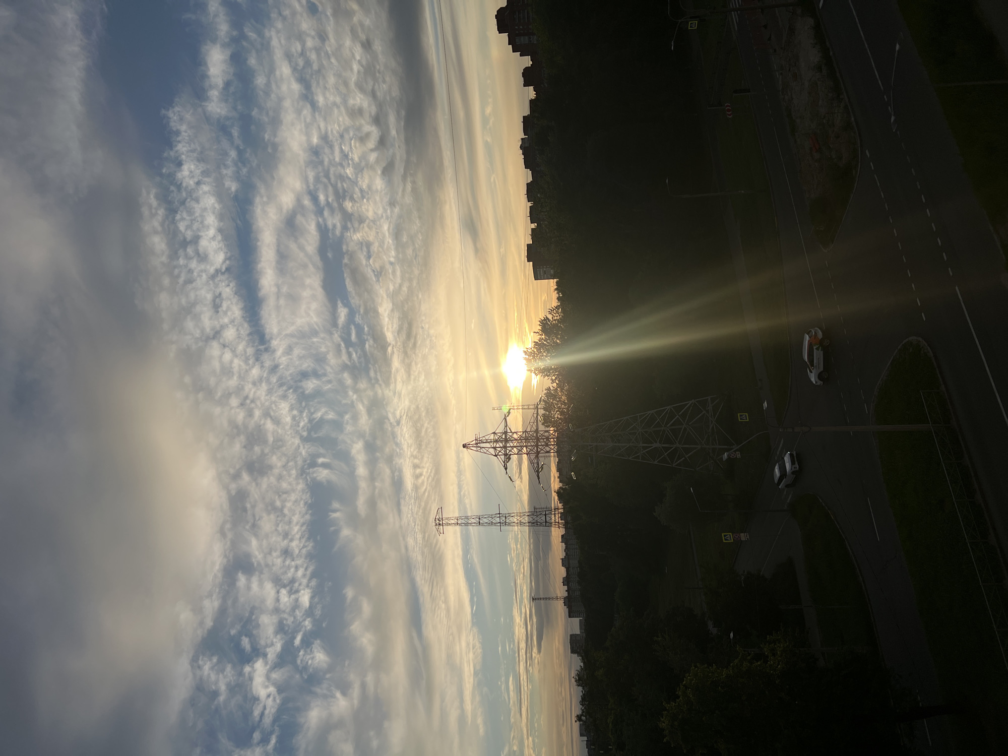 Saint Petersburg summer sunset, pylons and apartments under golden skies