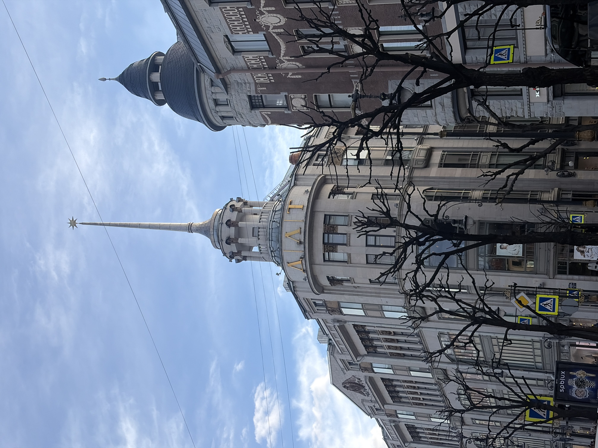 Tourist documents Saint Petersburg landmarks and selfies during afternoon walkabout