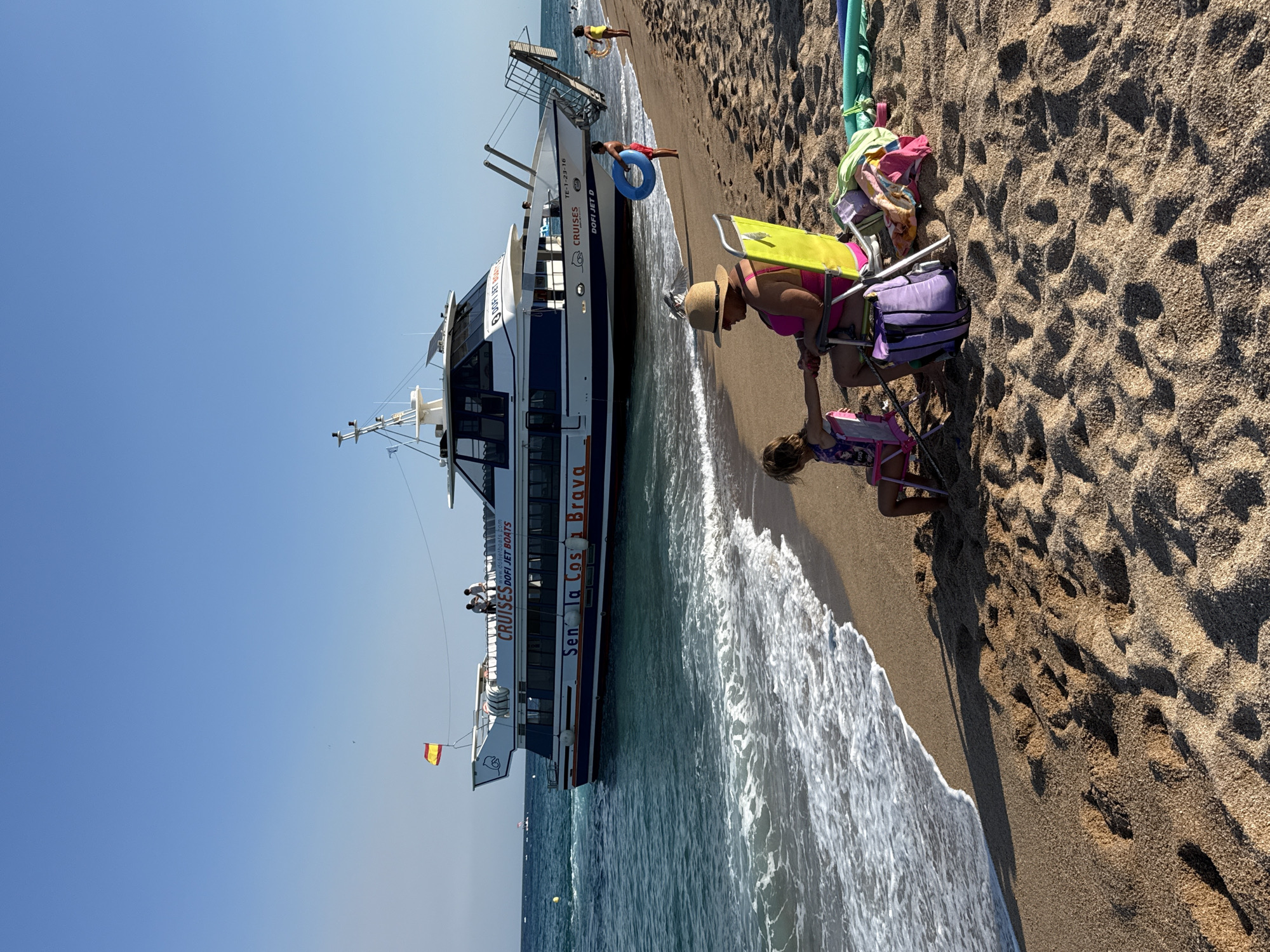 Lazy afternoon on the Blanes waterfront with a docked cruise boat