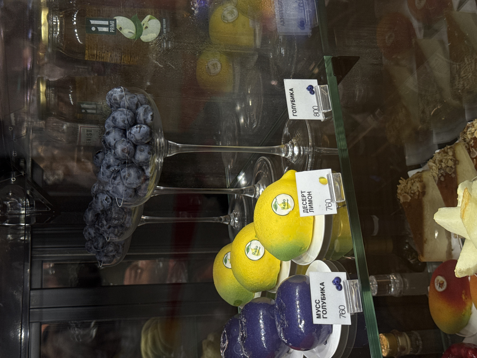 Dessert display case packed with pastries and fruit in Khimki