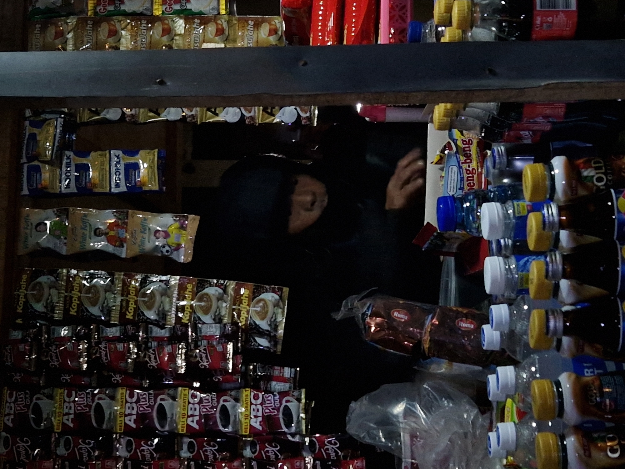Person spotted in dimly lit shop in Indonesia