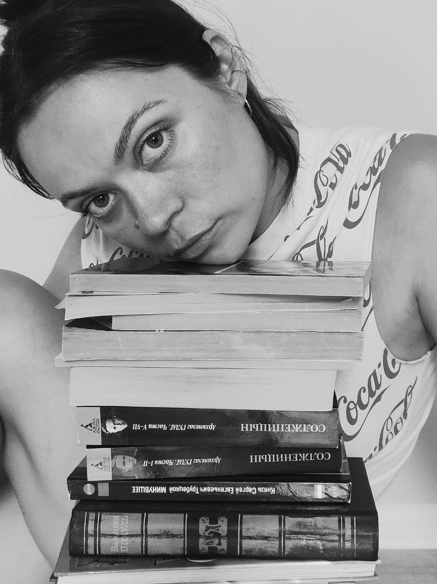 Quiet domestic moments captured: woman, children, books at home