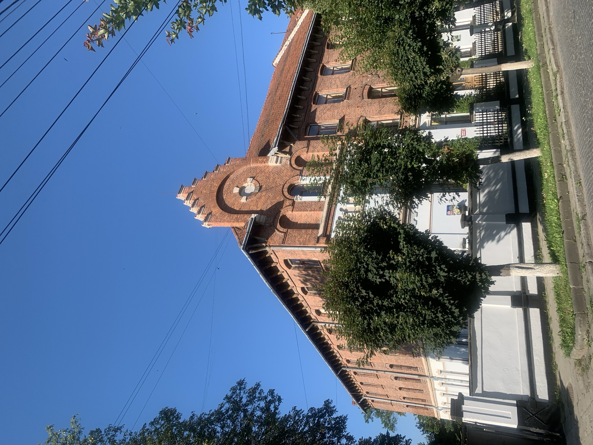Kolomyia's brick churches and cathedral on a clear summer morning