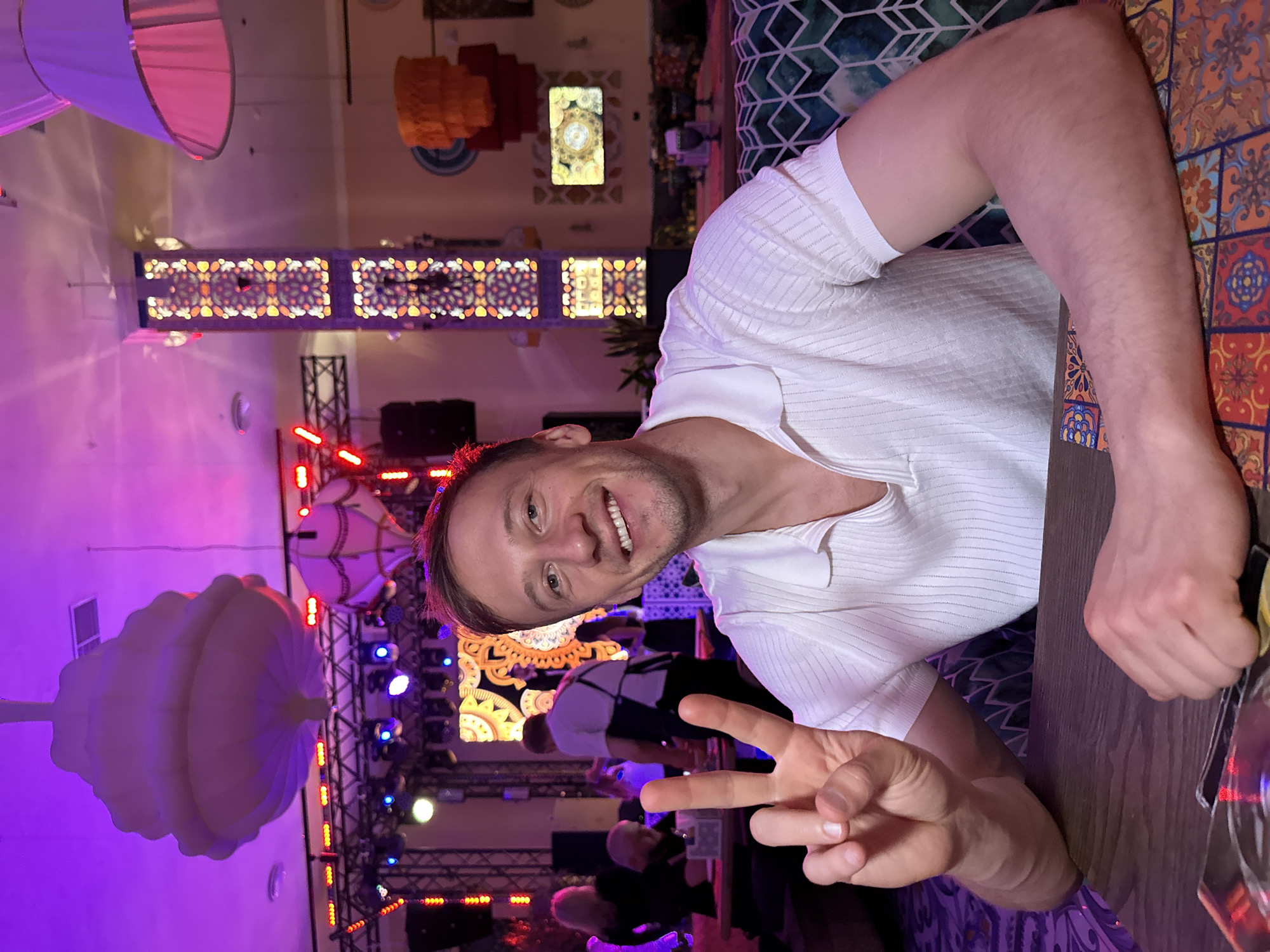 Peace signs at a wooden table in Sinyavino, Russia