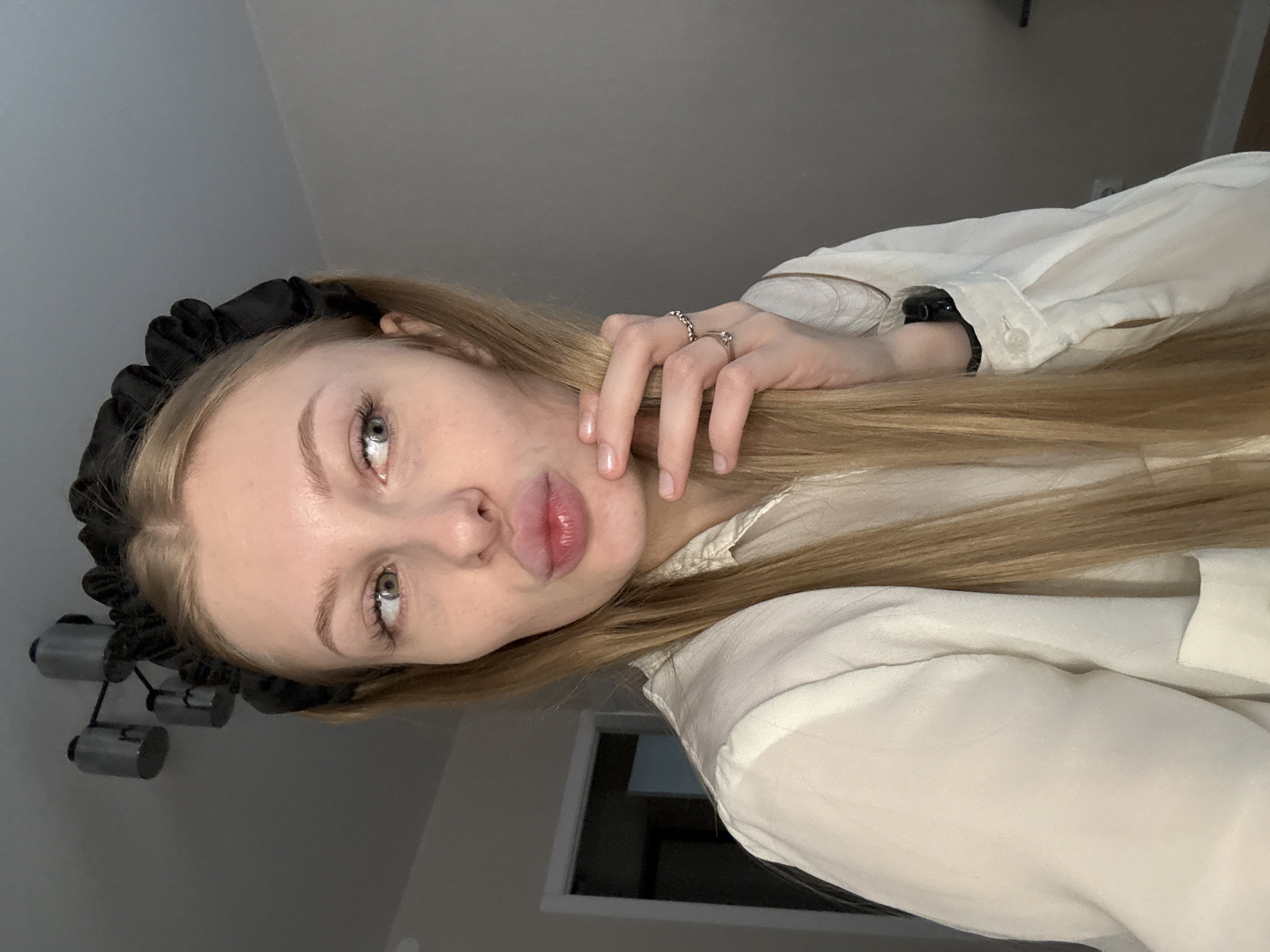 Woman takes selfies during rainy afternoon in Perm