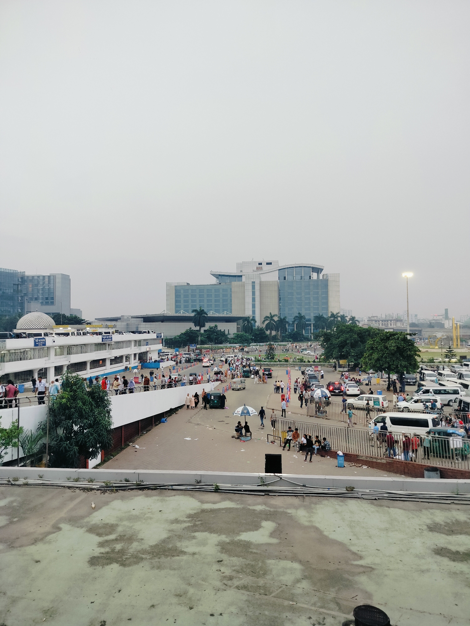 People and luggage moving through a busy urban block