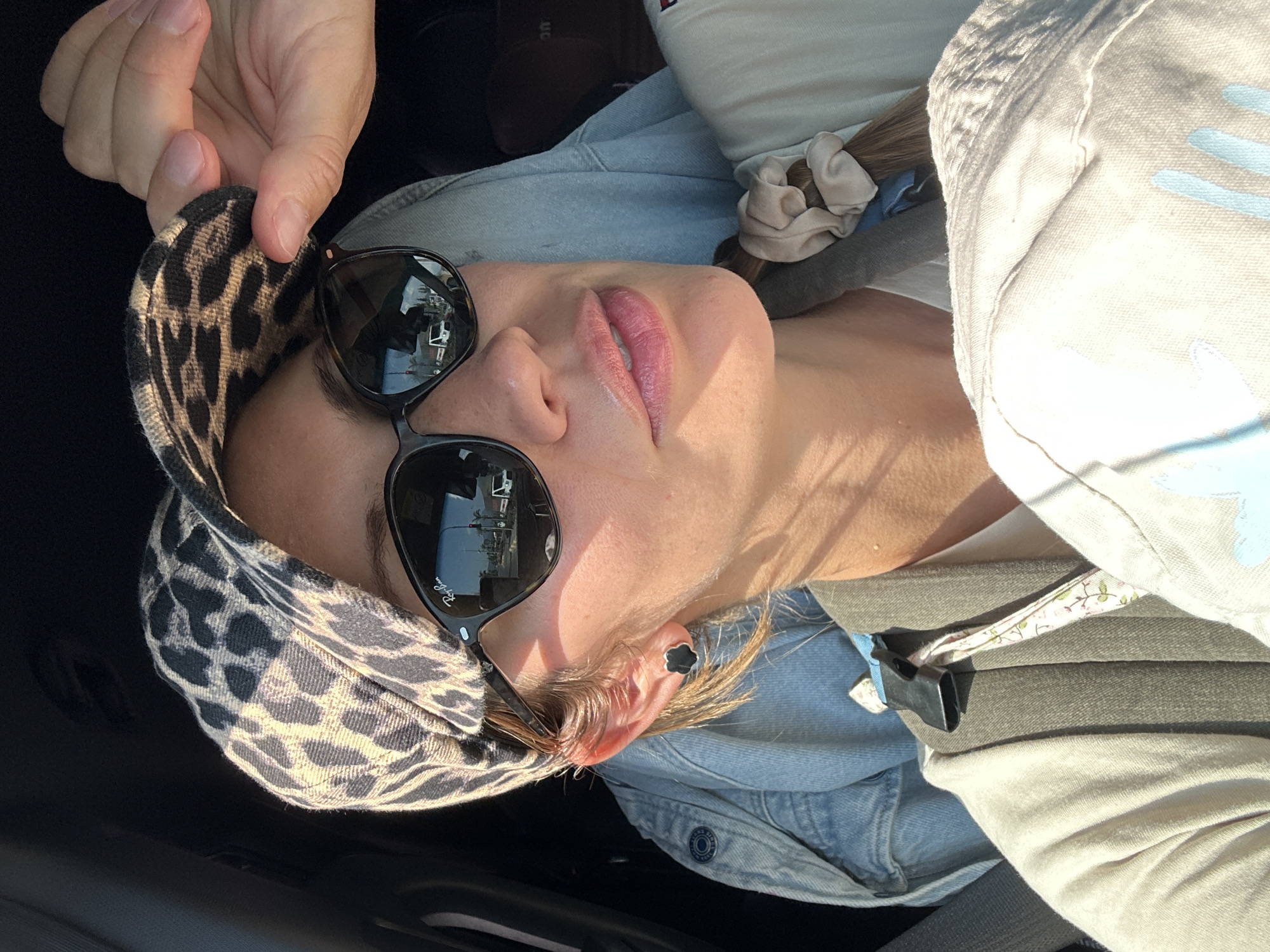 Woman photographed in vehicle on sunny Fethiye street