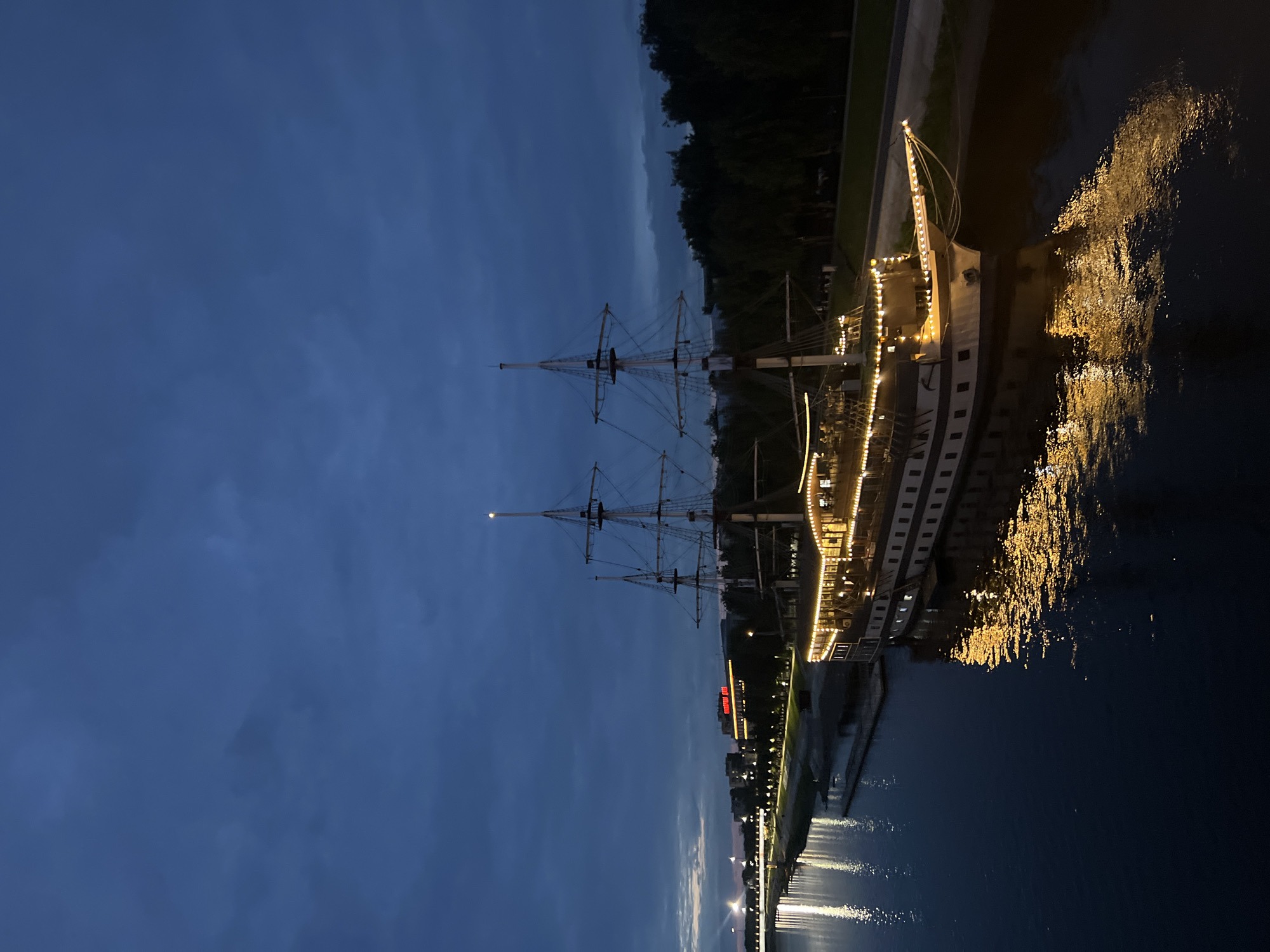 Dusk at the Novgorod Kremlin: river, bridges, and evening crowds