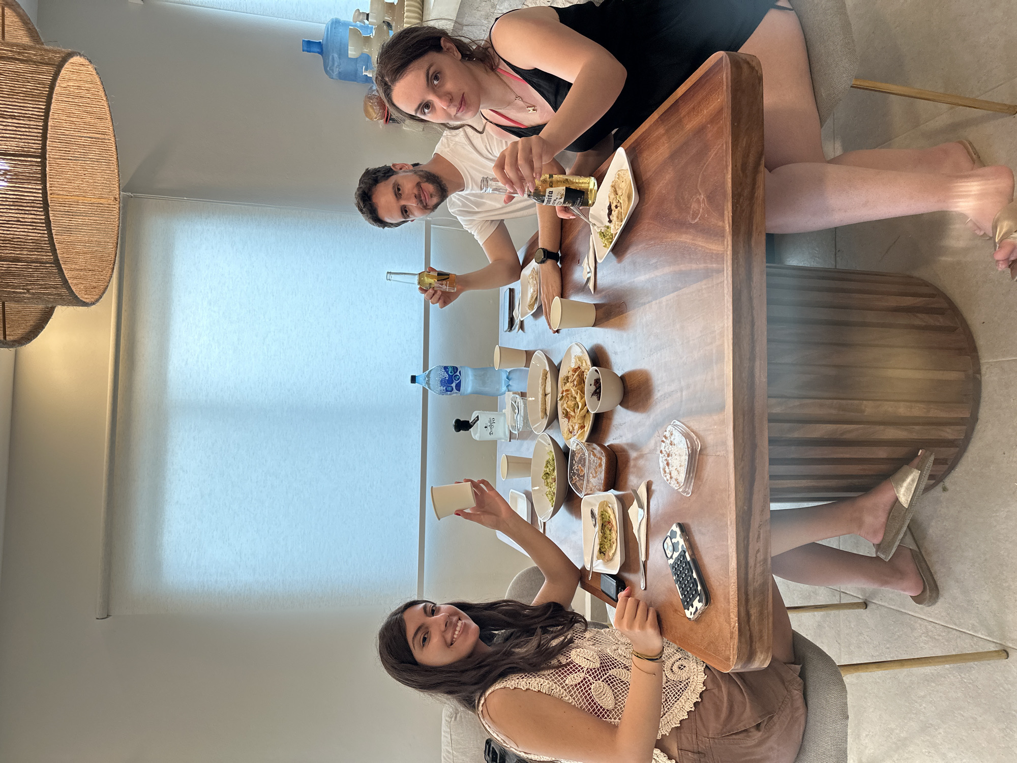 Friends share traditional Mexican meal with chapulines in Zicatela