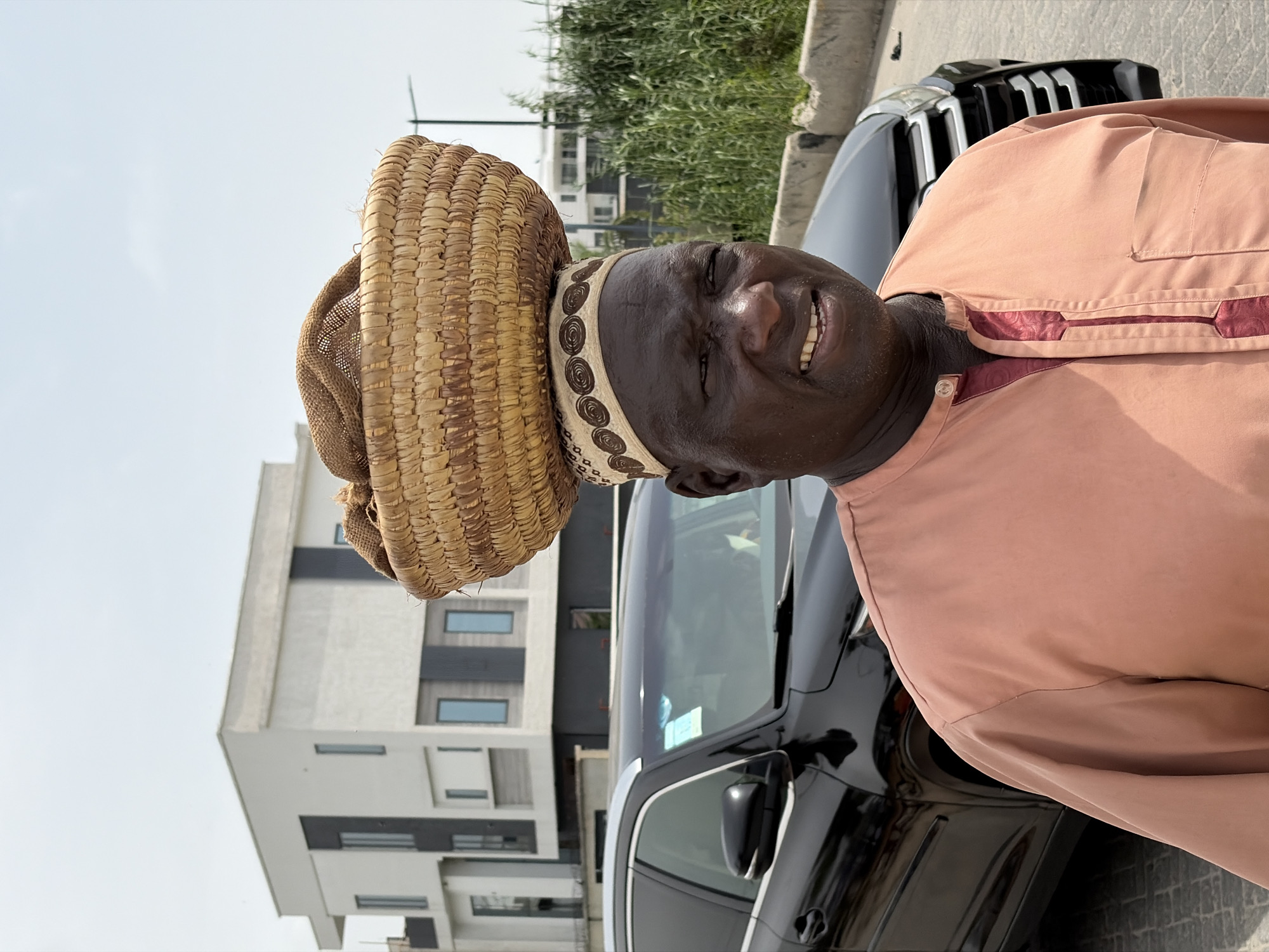 Man in traditional dress spotted near Mercedes in Moba