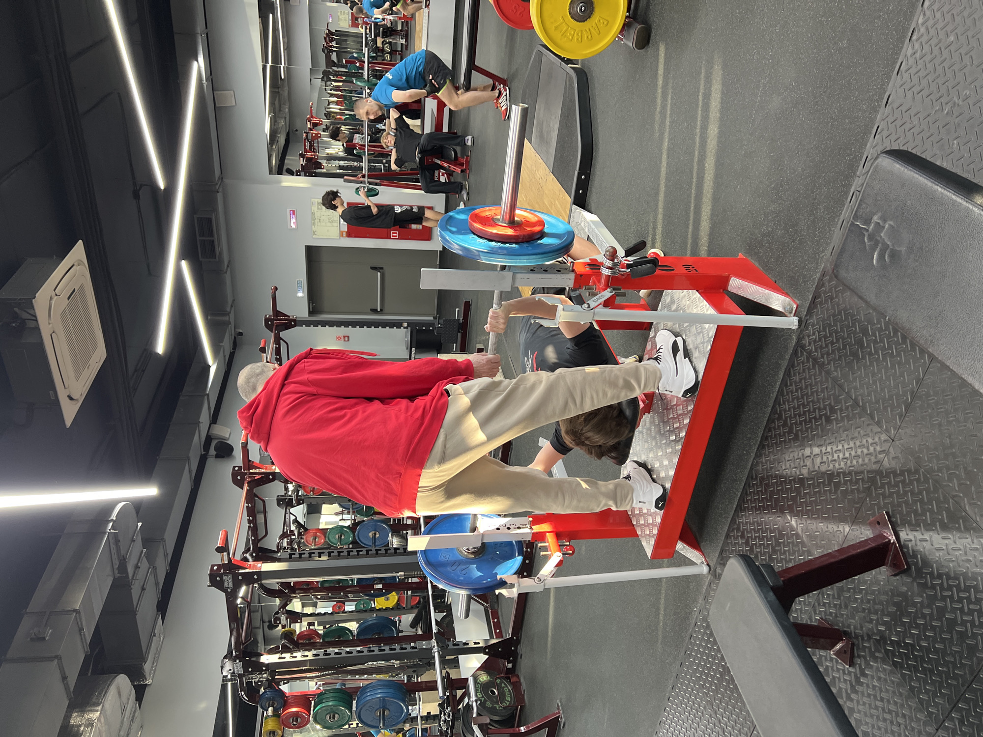 Two men spotted exercising at Khimki gym