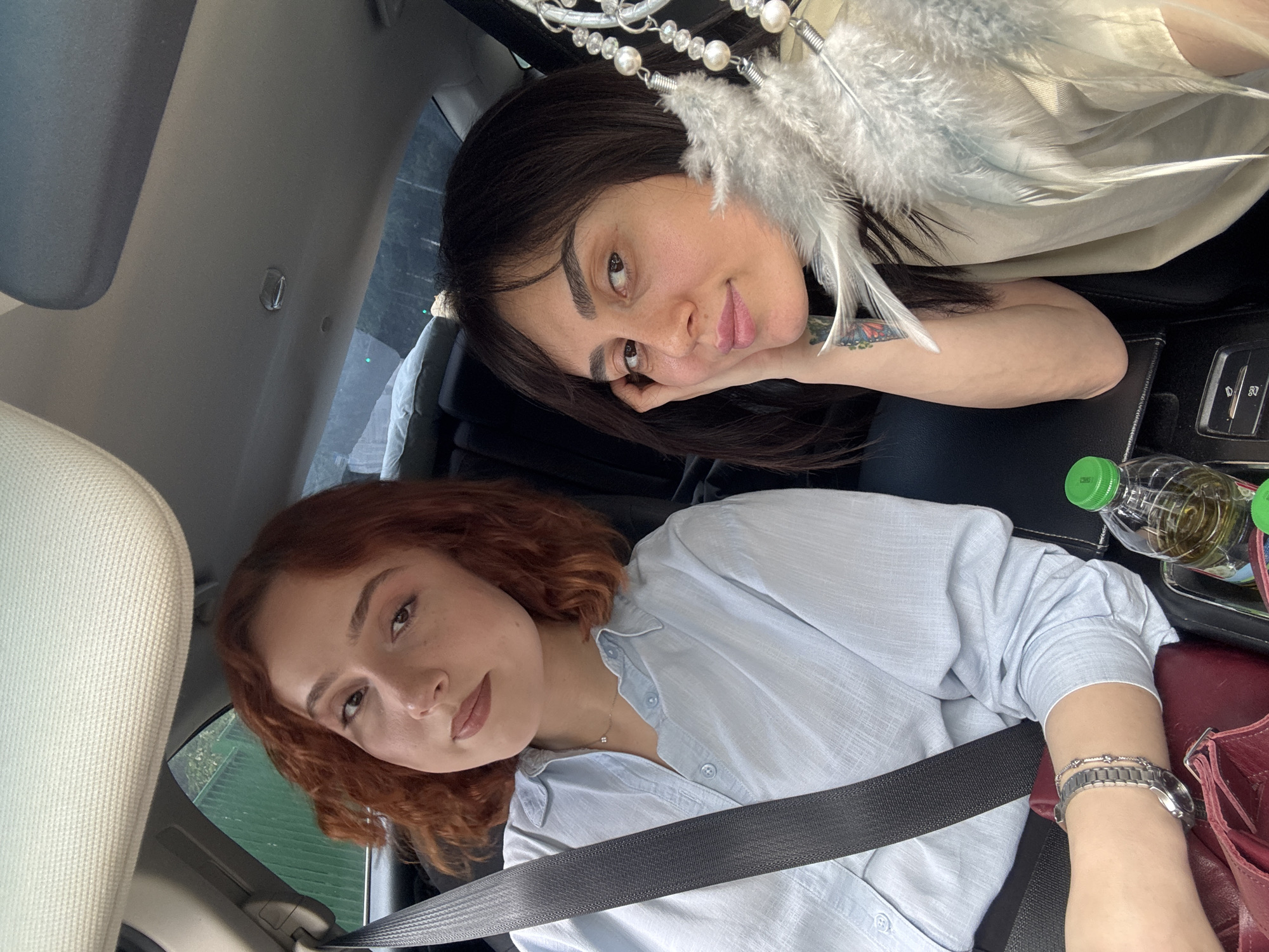 Two women take car selfies in Tbilisi