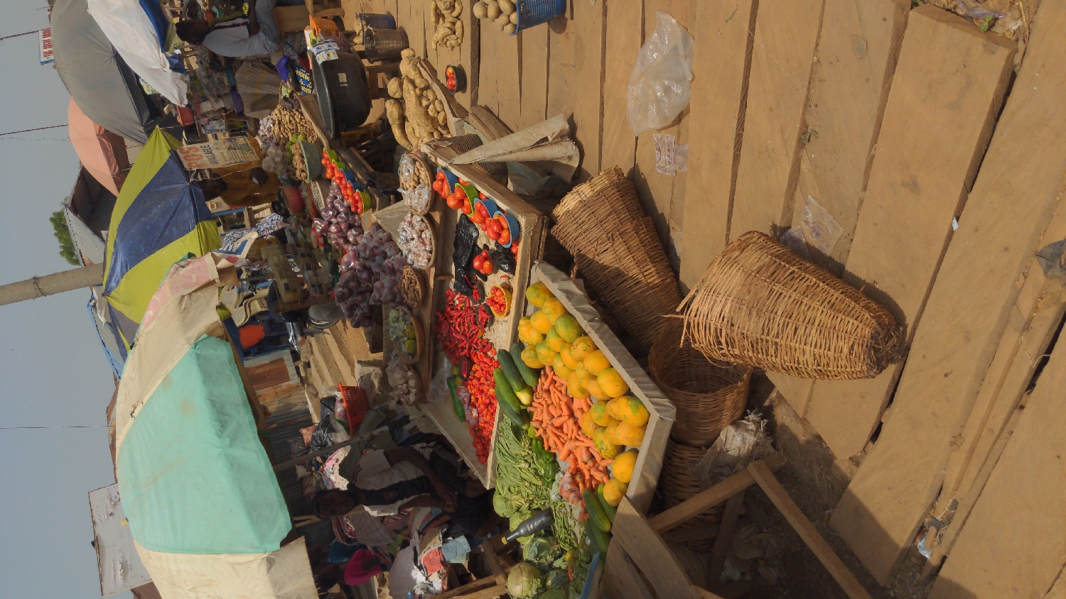 Outdoor market bustles with fresh produce in Ado Nigeria